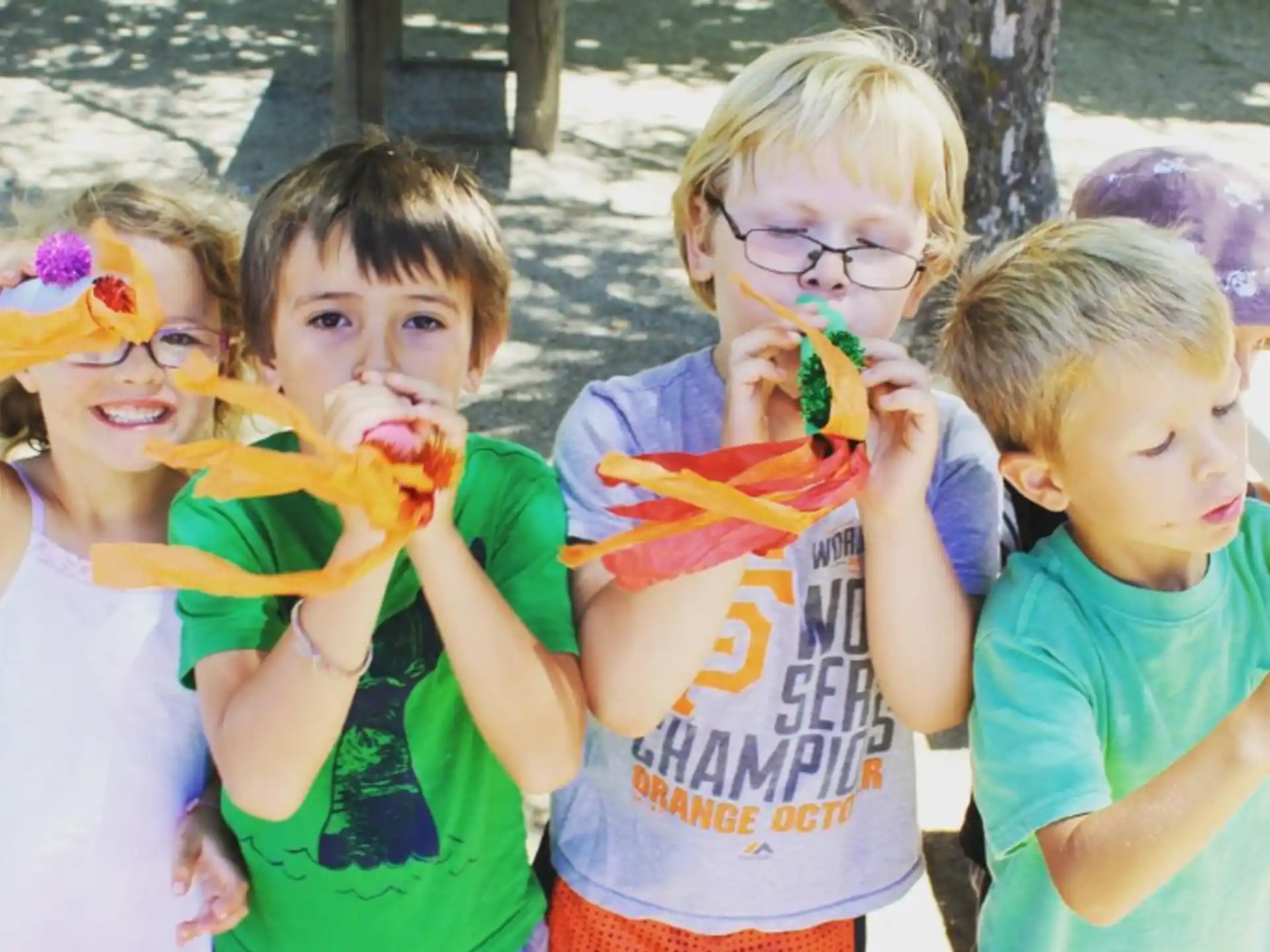 a group of kids eating food