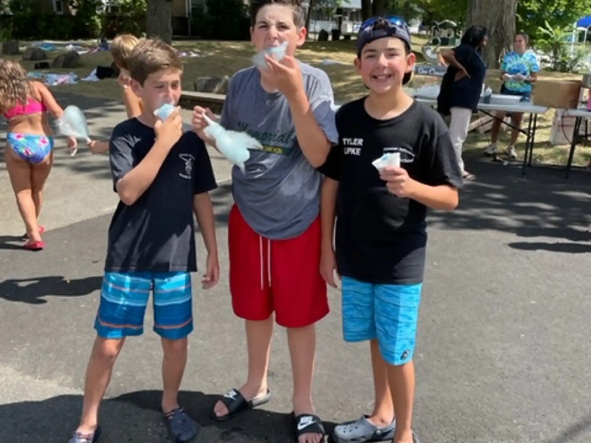 a group of boys holding ice cream cones