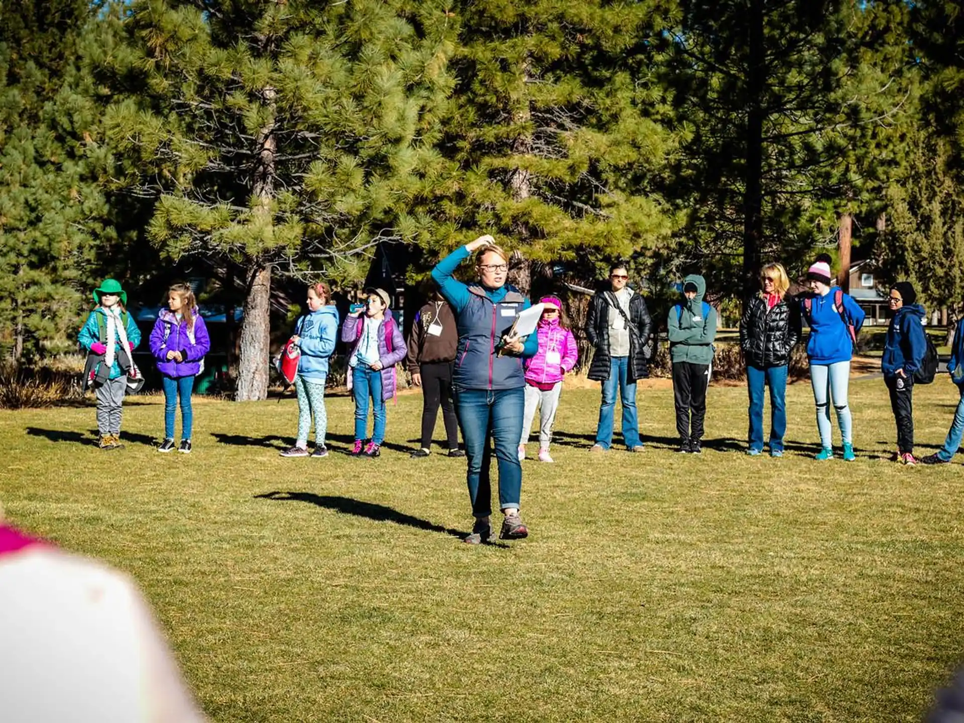 a group of people standing in a field