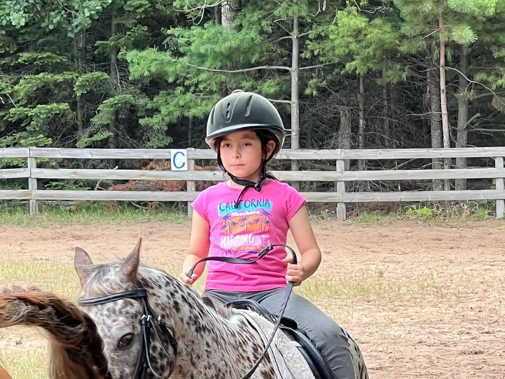 a girl riding a horse