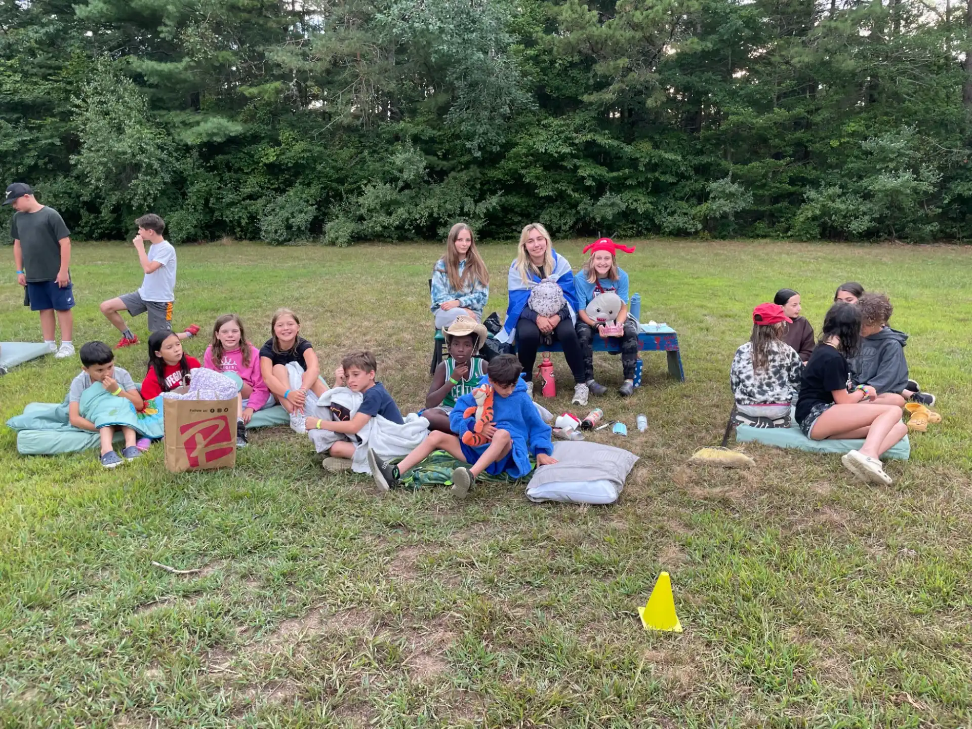 a group of people sitting on the ground