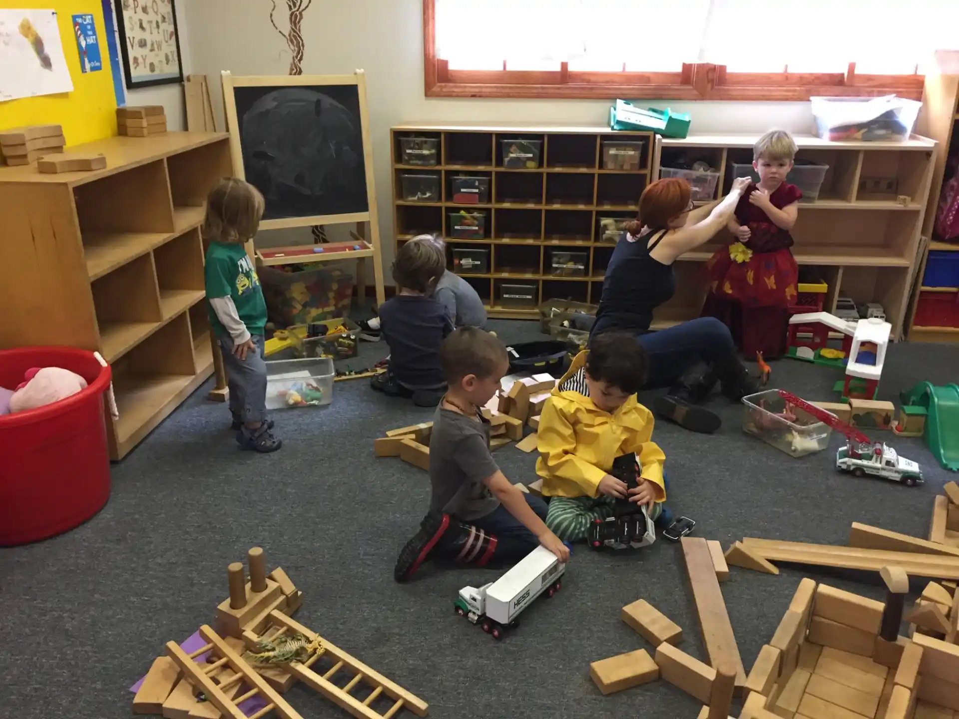 a group of children playing with toys