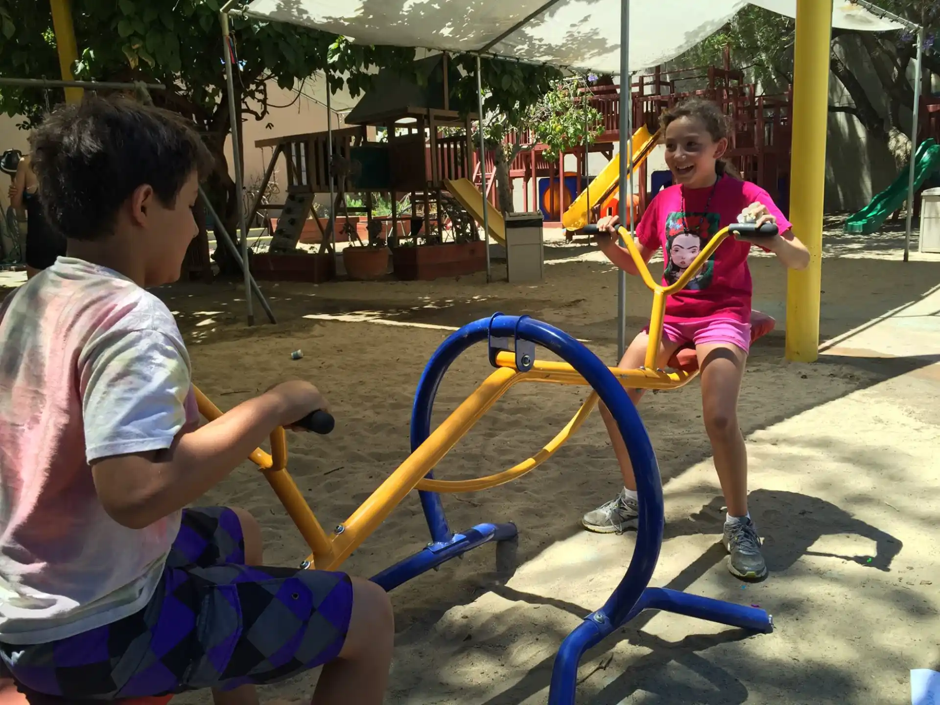 a person and a girl playing with a toy