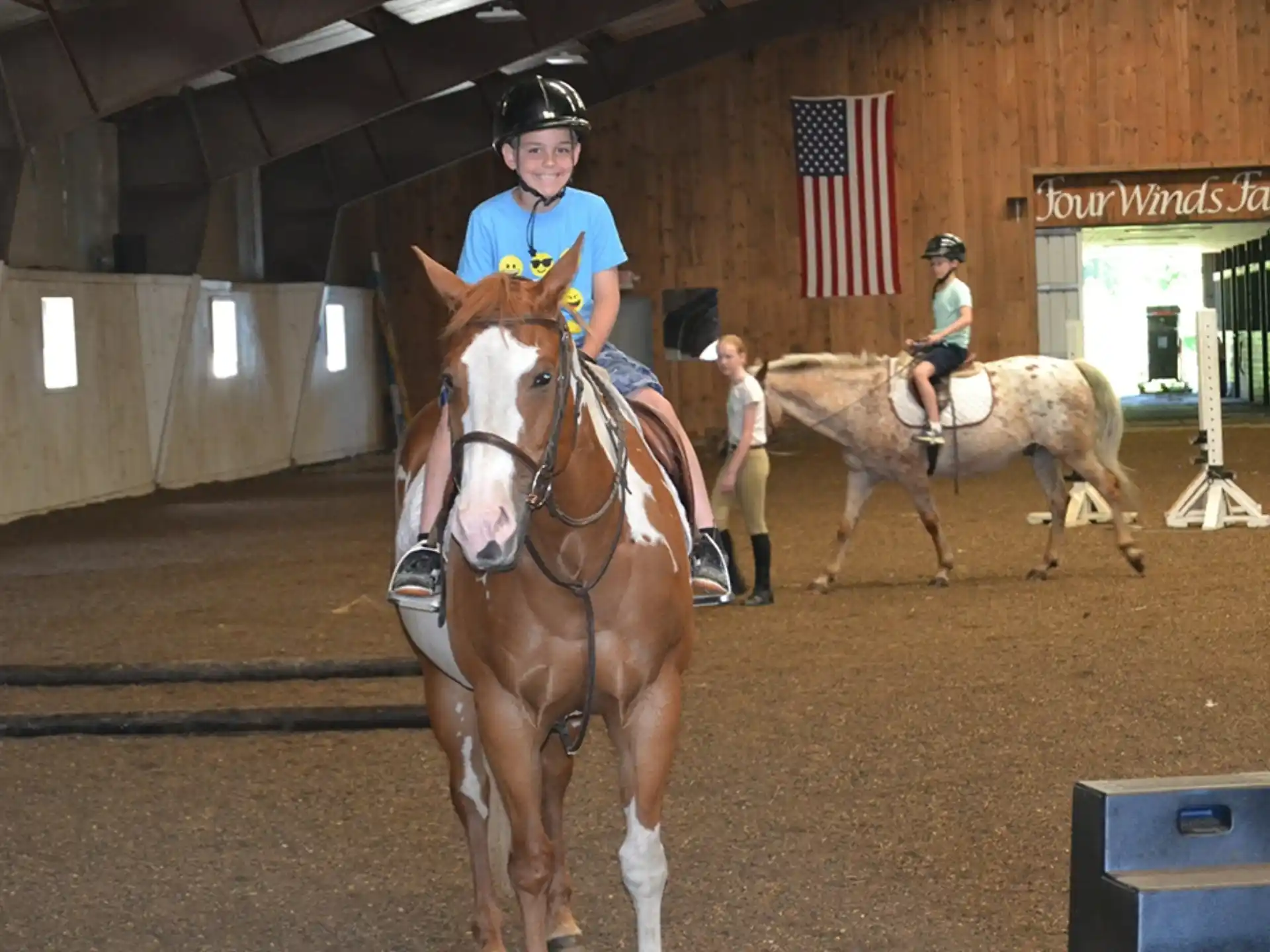 a couple of people riding horses