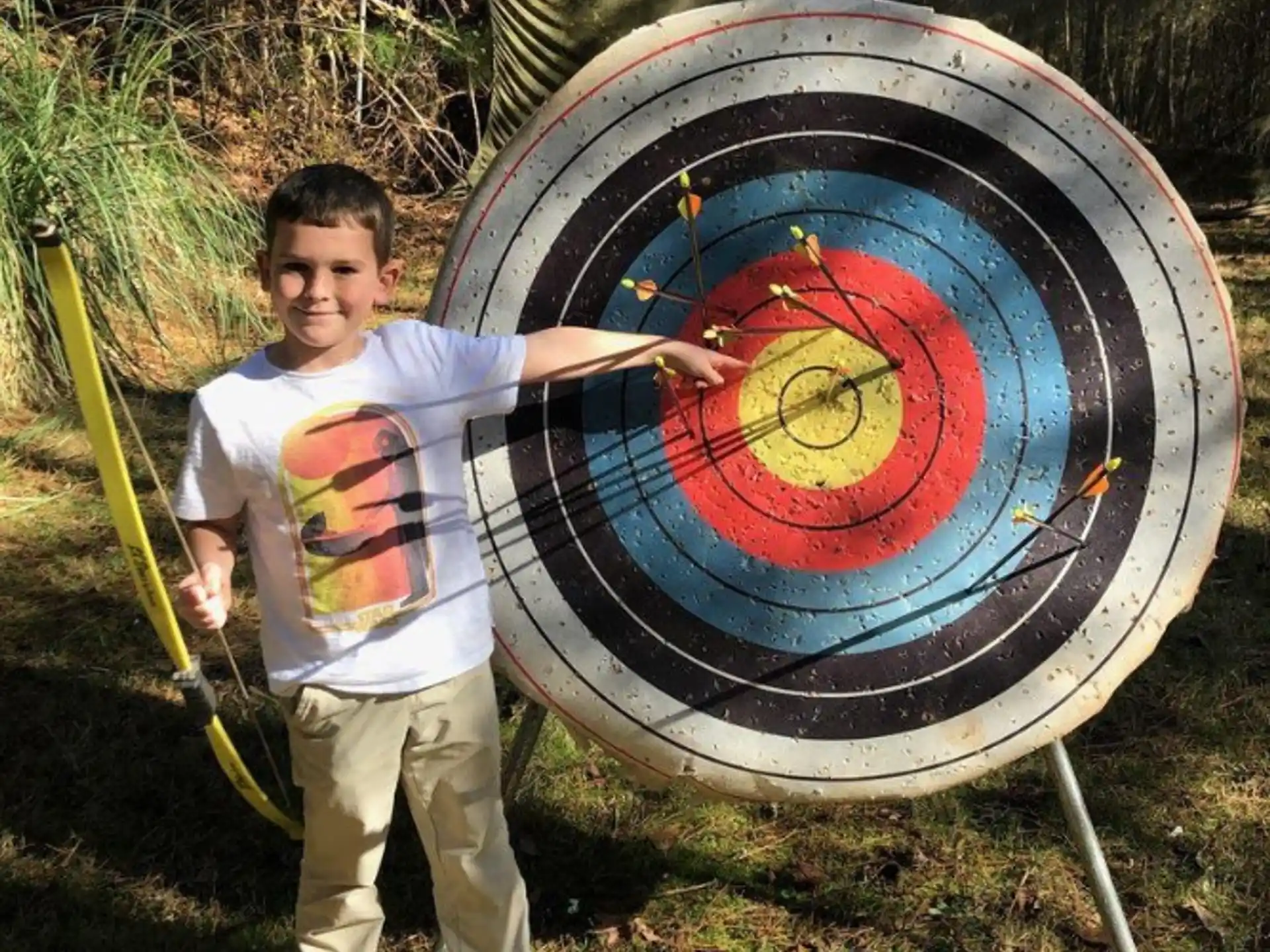 a boy holding a target