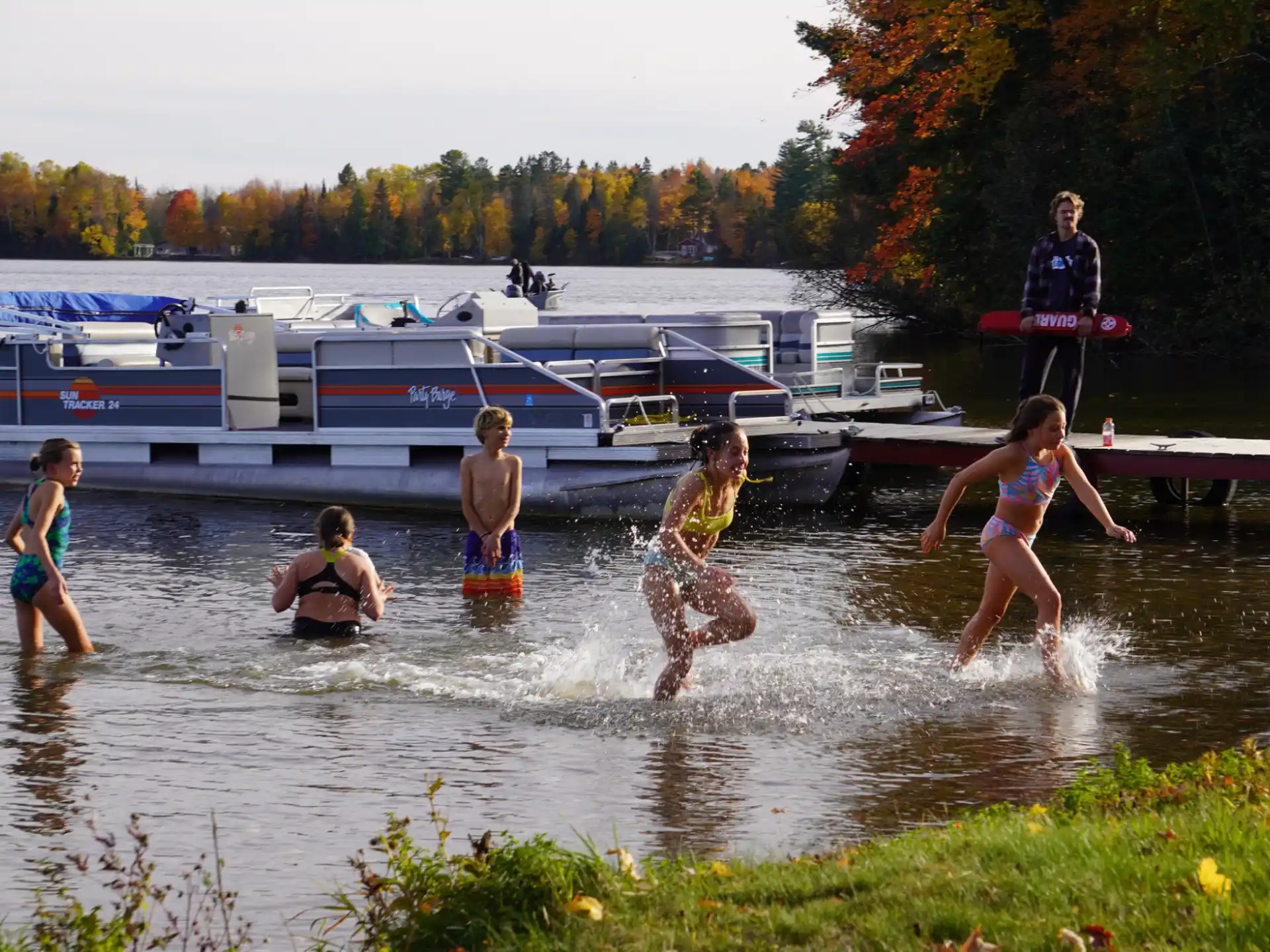 a group of people playing in the water