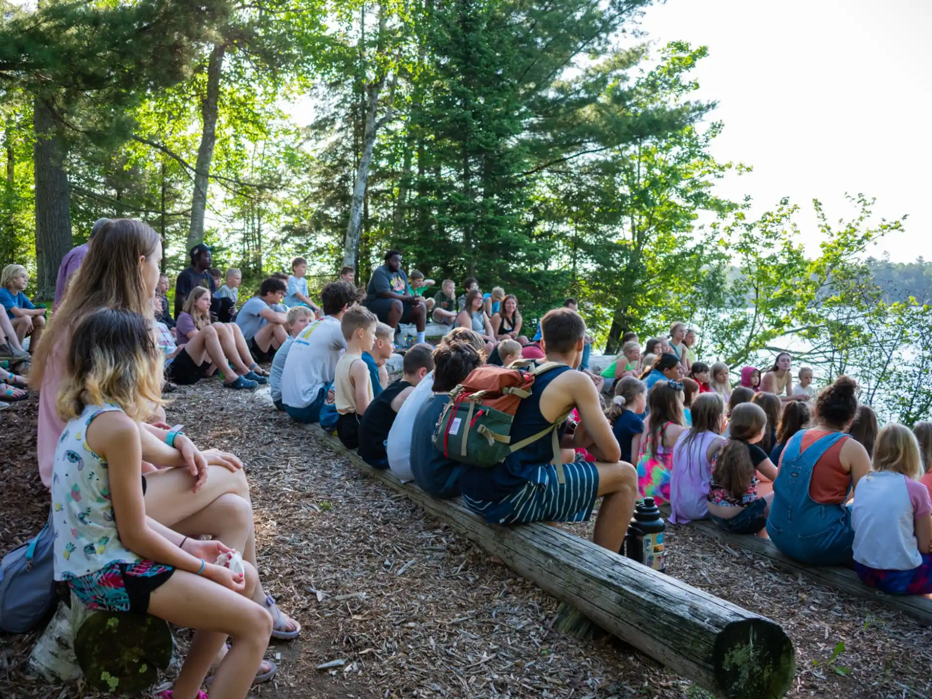 a group of people sitting on the ground