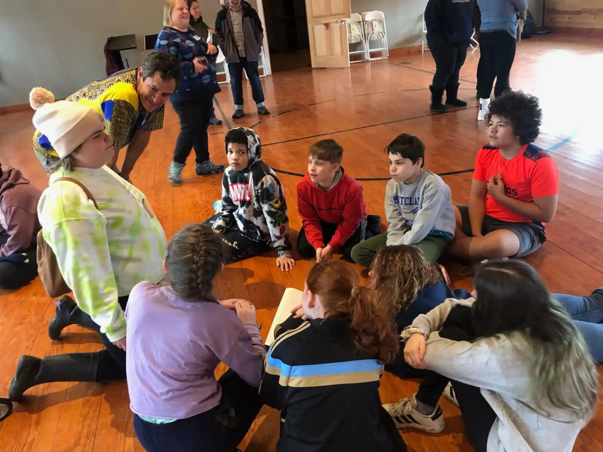 a group of children sitting on the floor