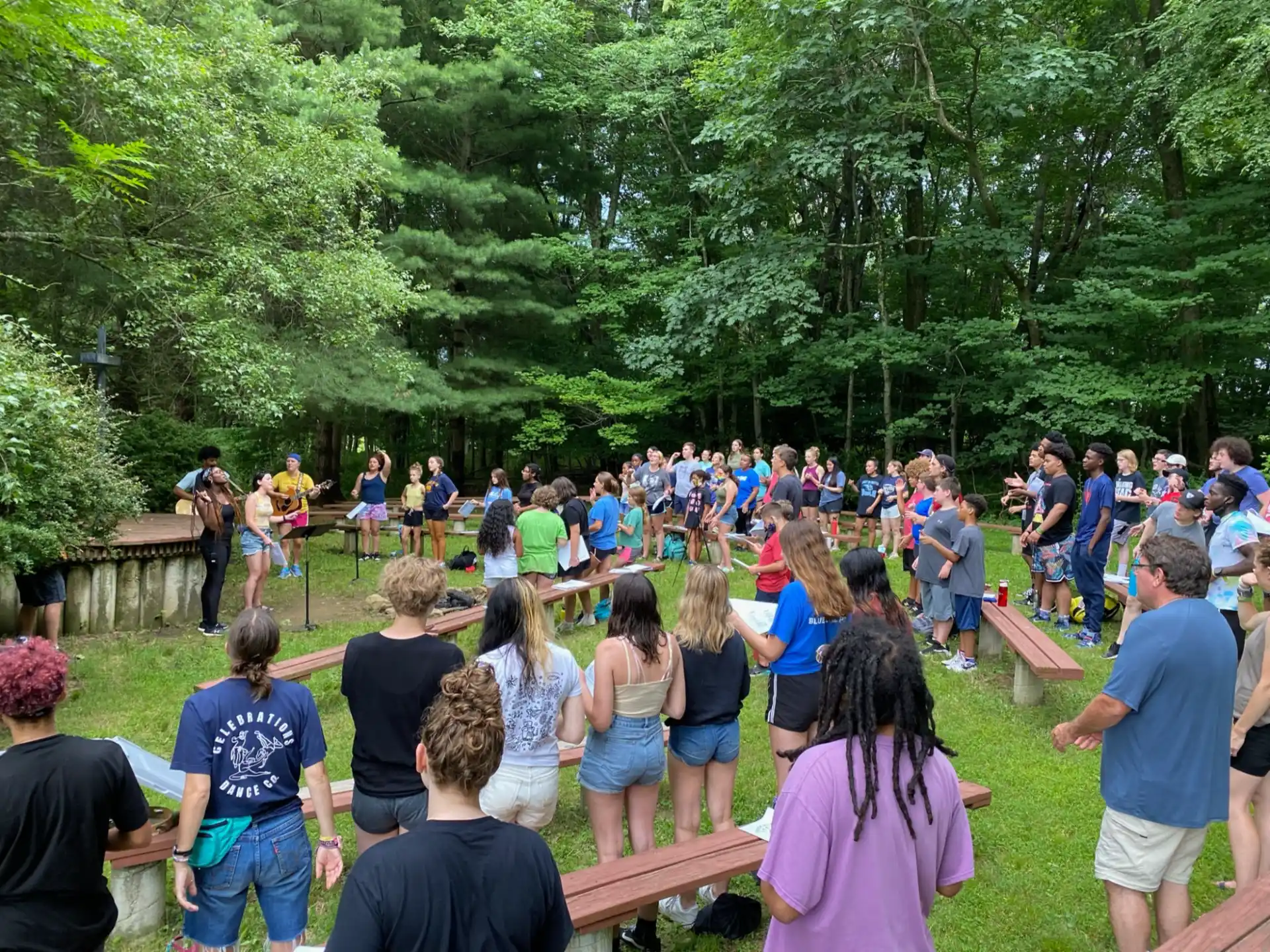 a group of people gathered around a stage