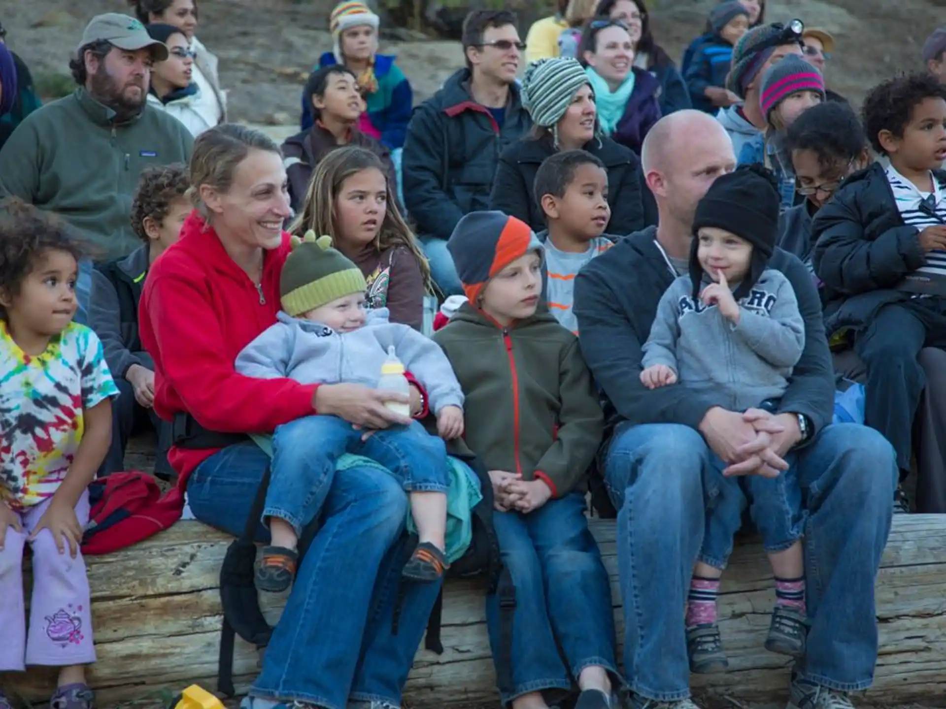 a group of people sitting on a bench