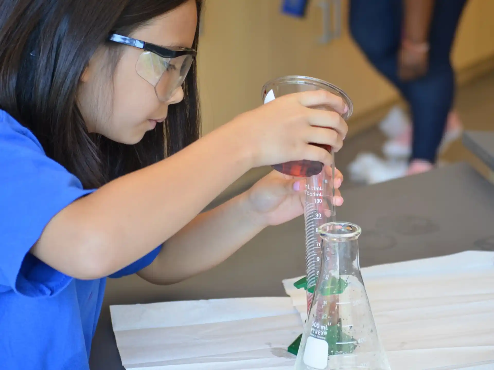 a woman holding a glass