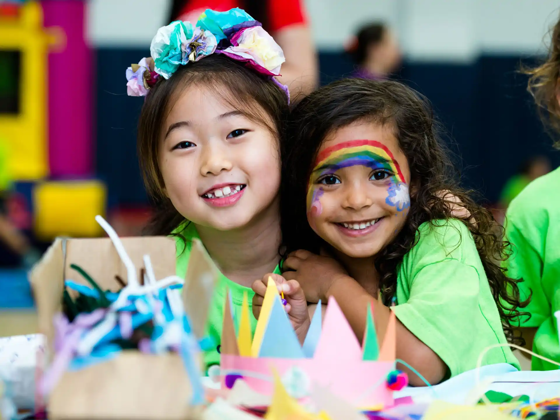 a group of girls wearing party hats