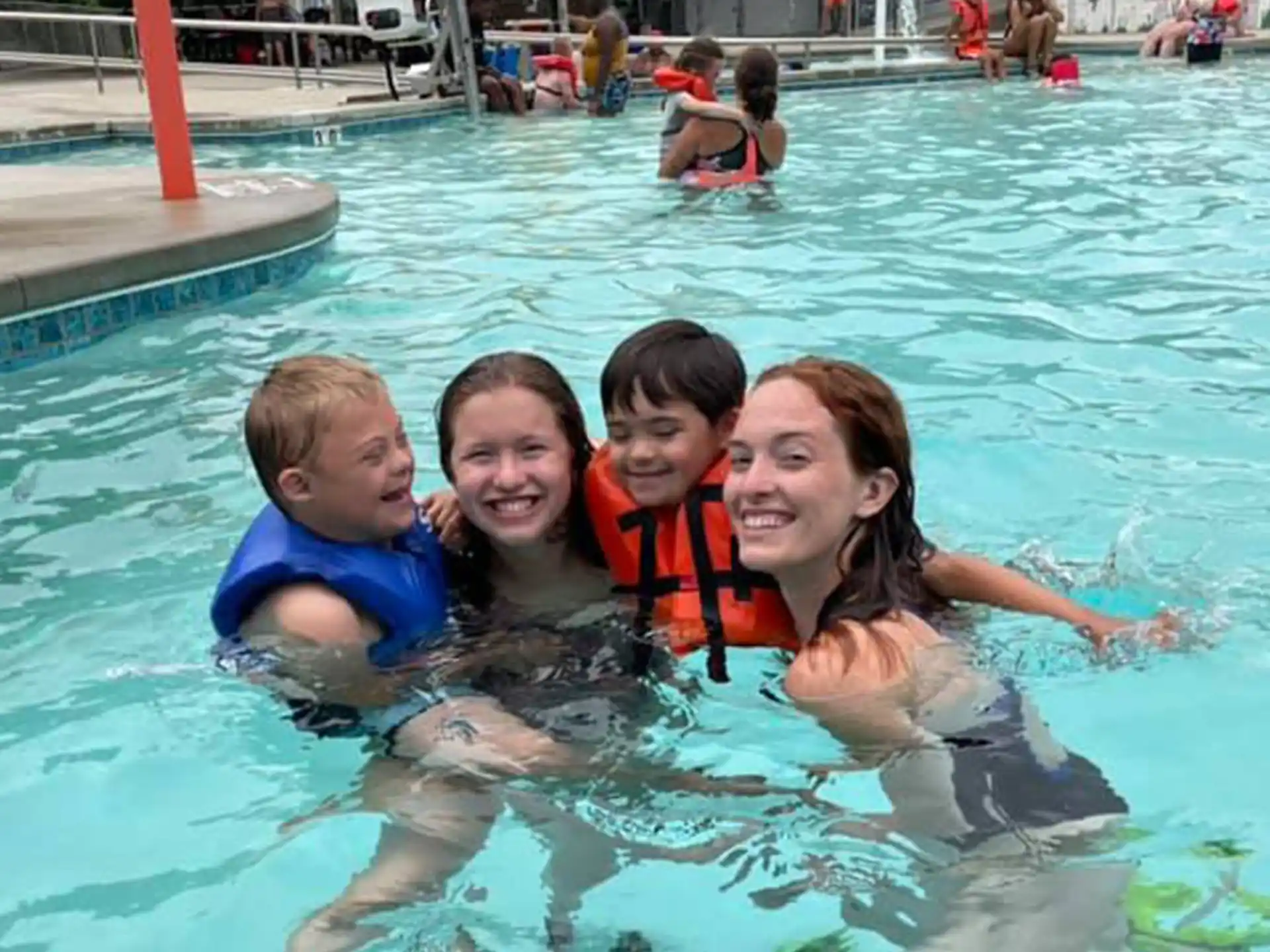 a group of people in a pool