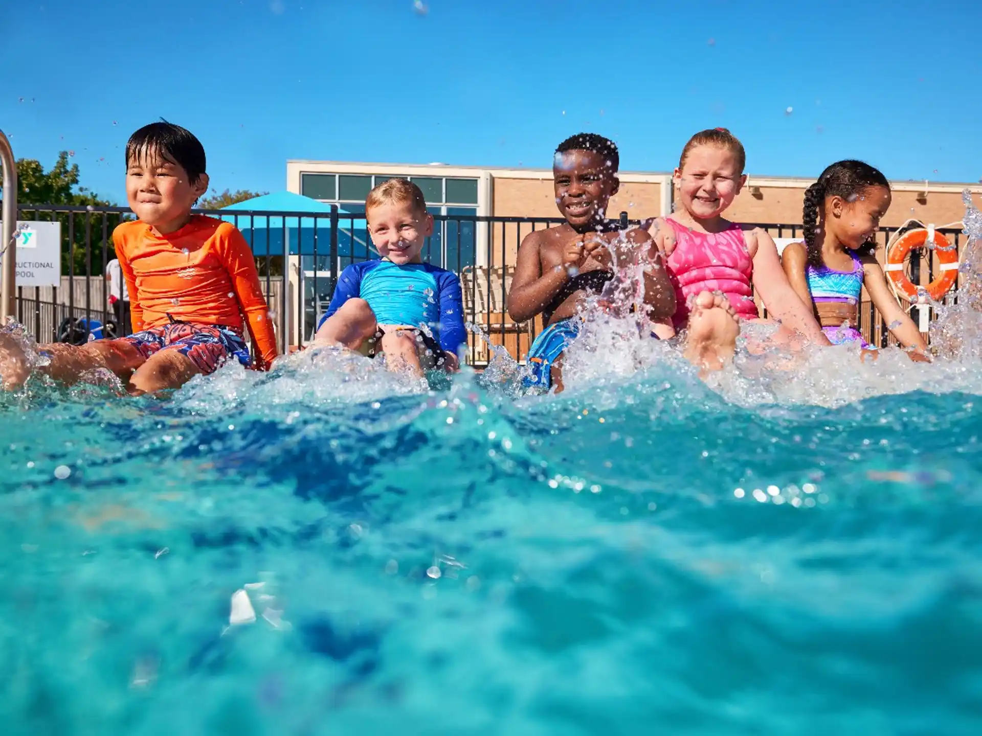 a group of kids in a pool