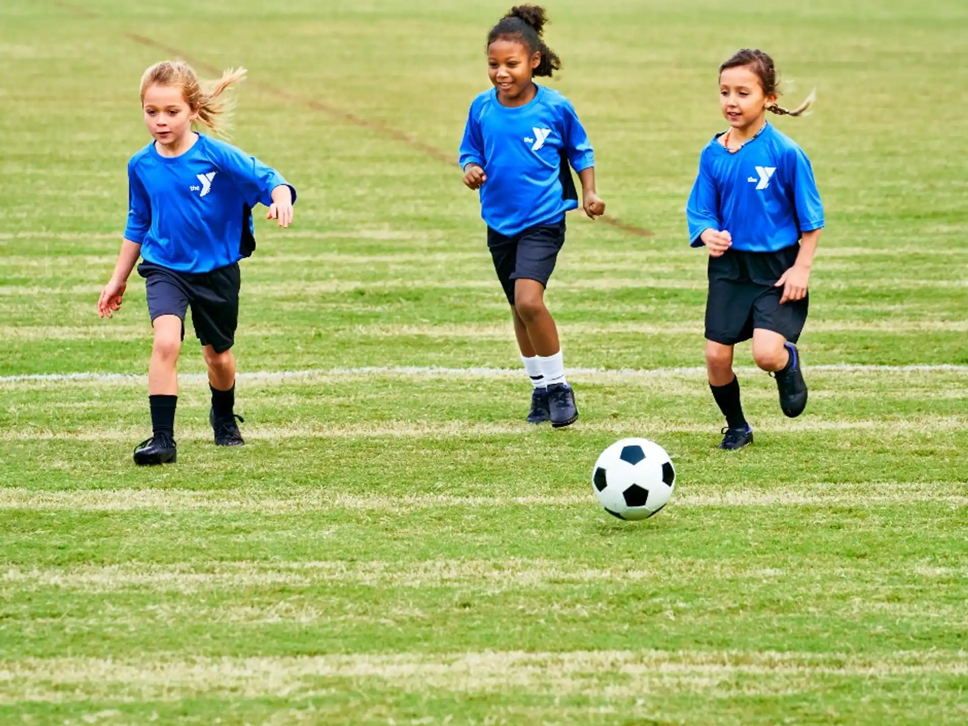a group of kids playing football