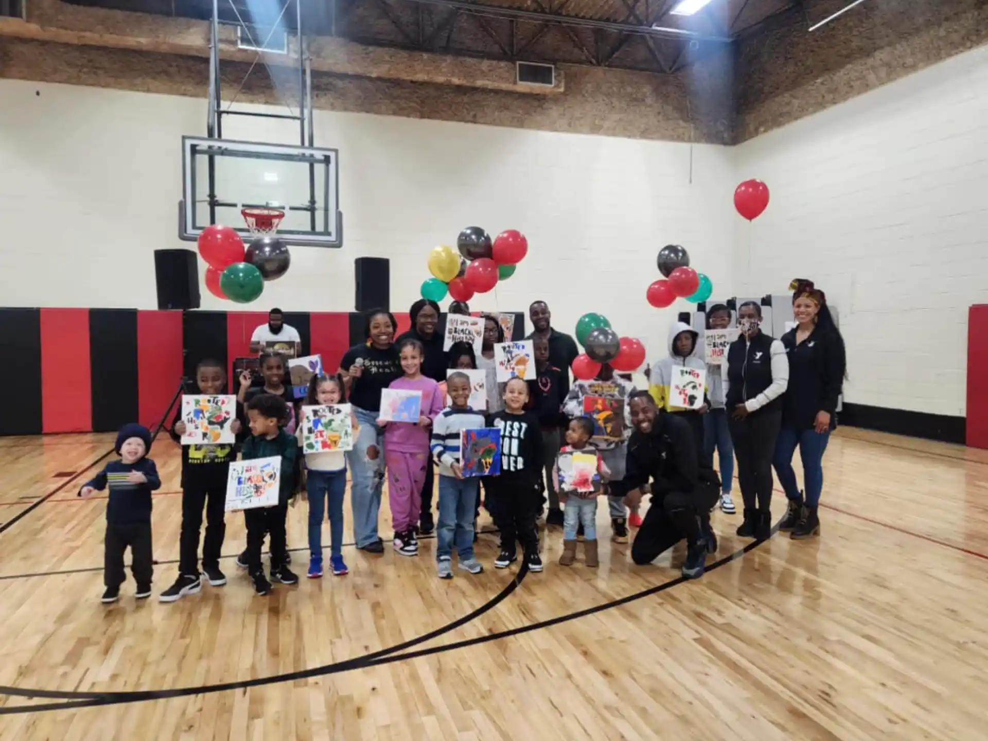 a group of people posing for a photo with balloons