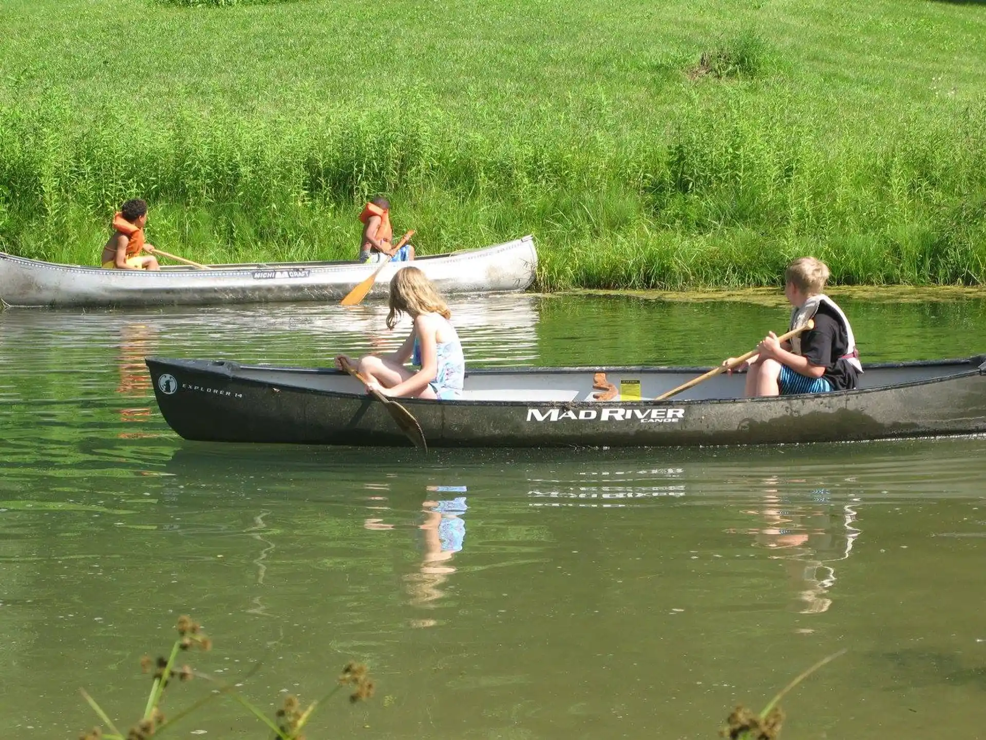 a group of people rowing a boat