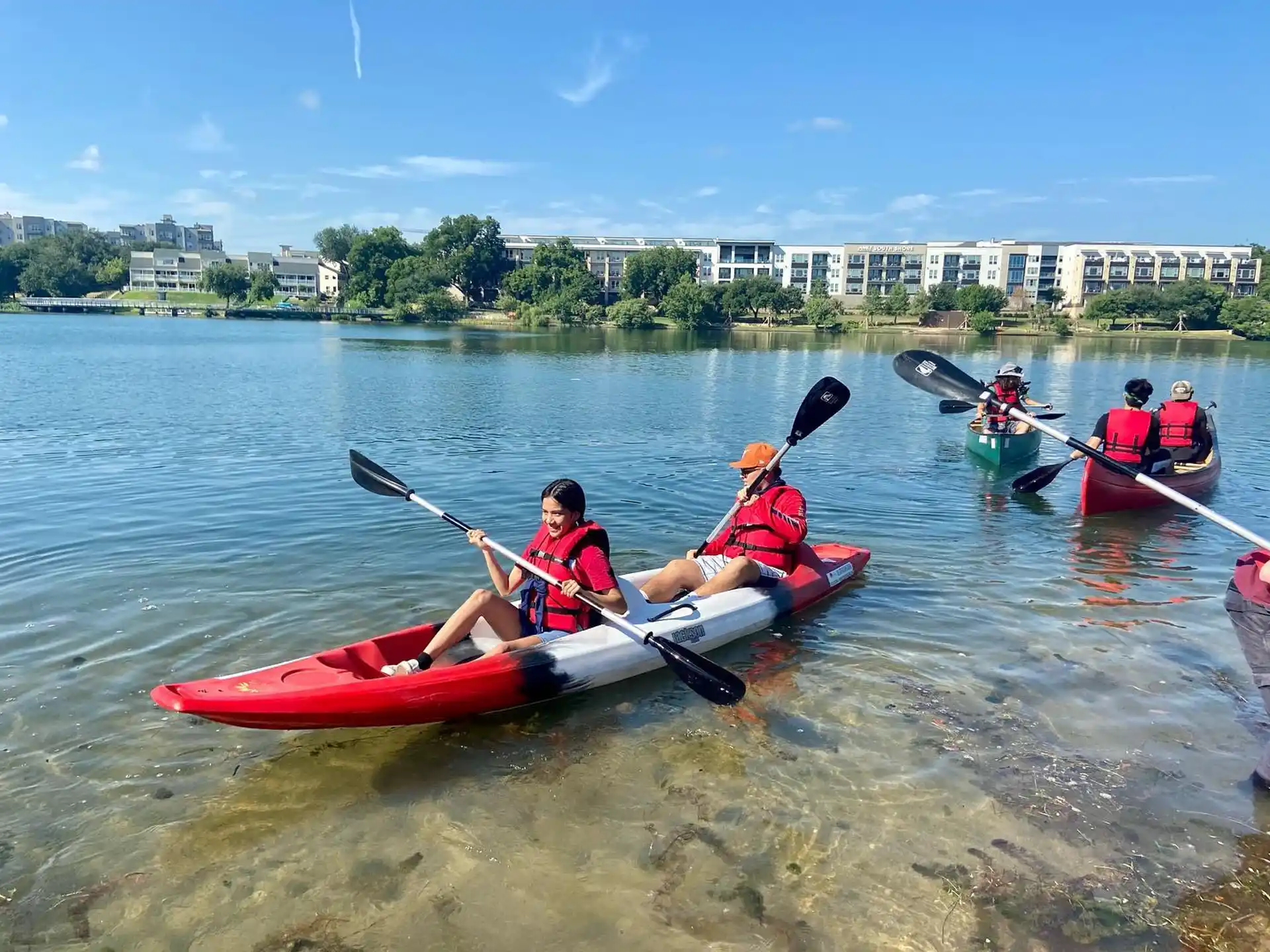 a group of people rowing a boat