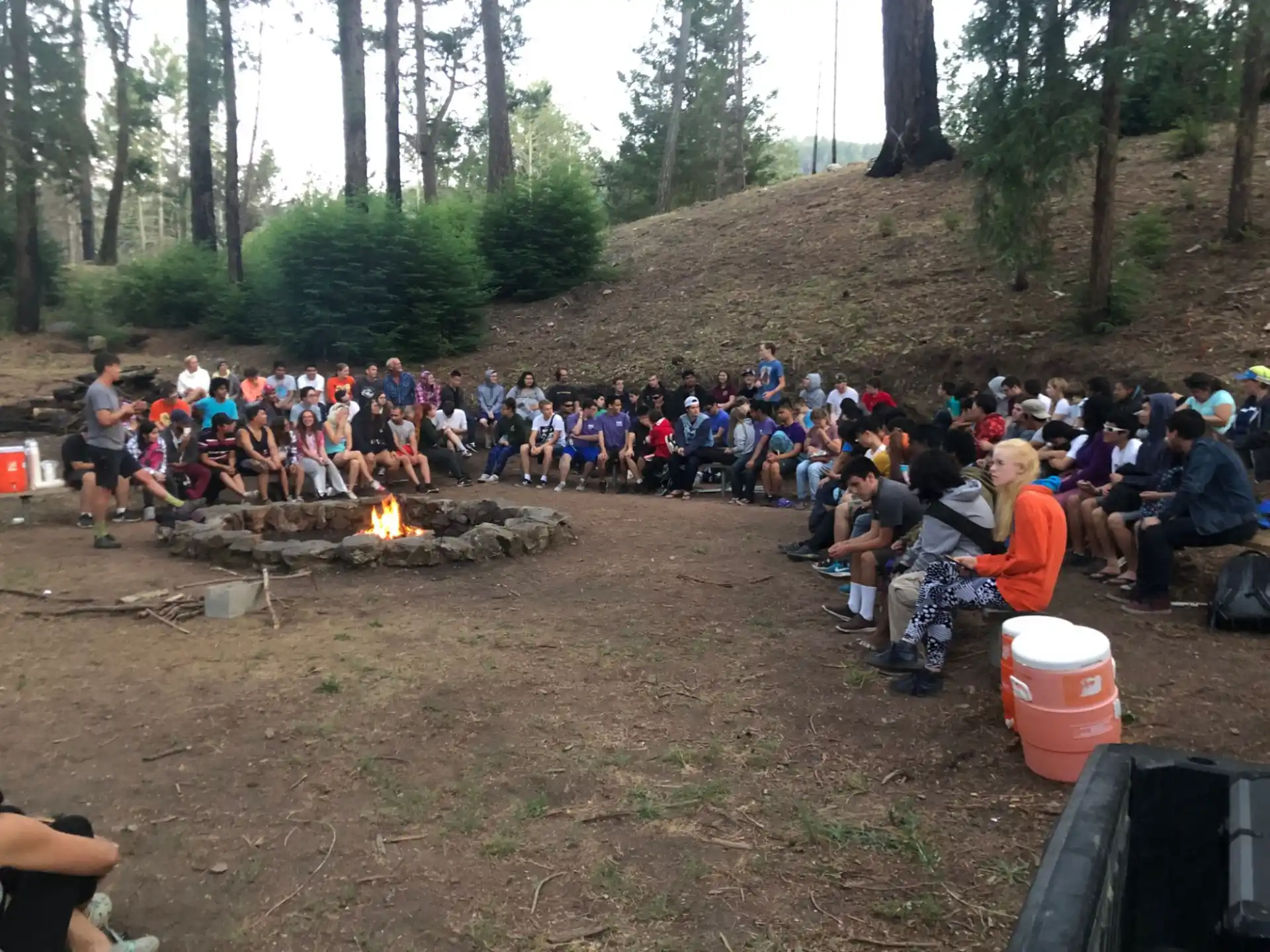 a large group of people sitting on the ground