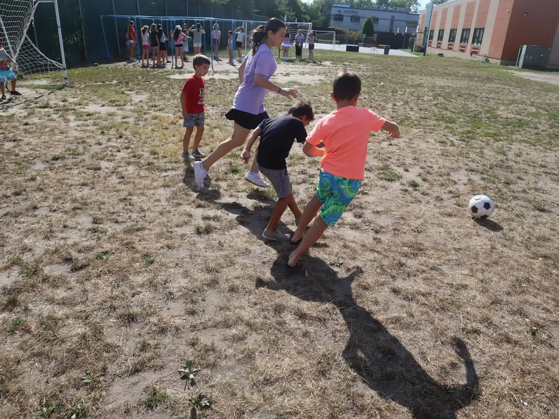 a group of kids playing football
