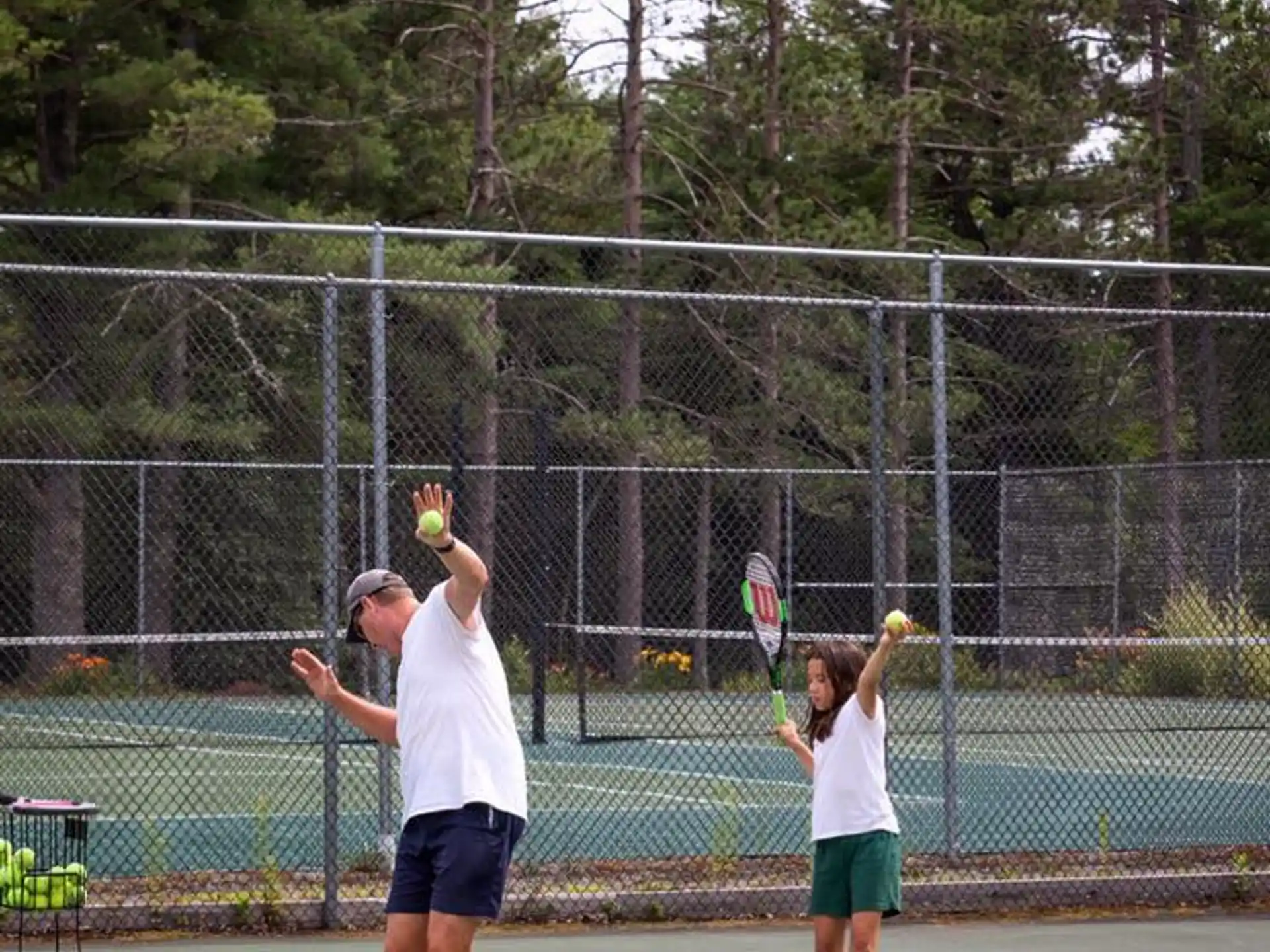 a man and a woman playing tennis