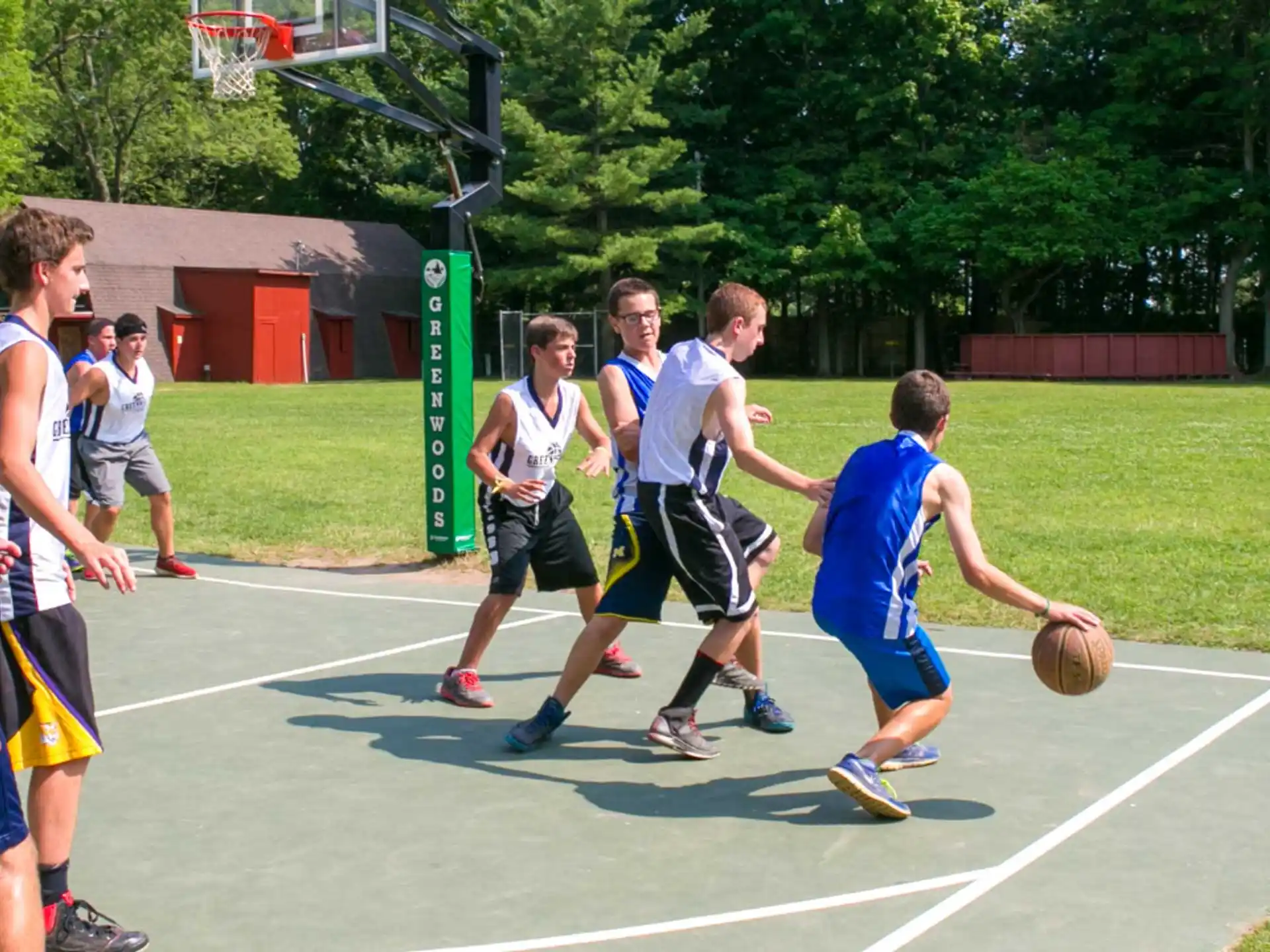 a group of people playing basketball