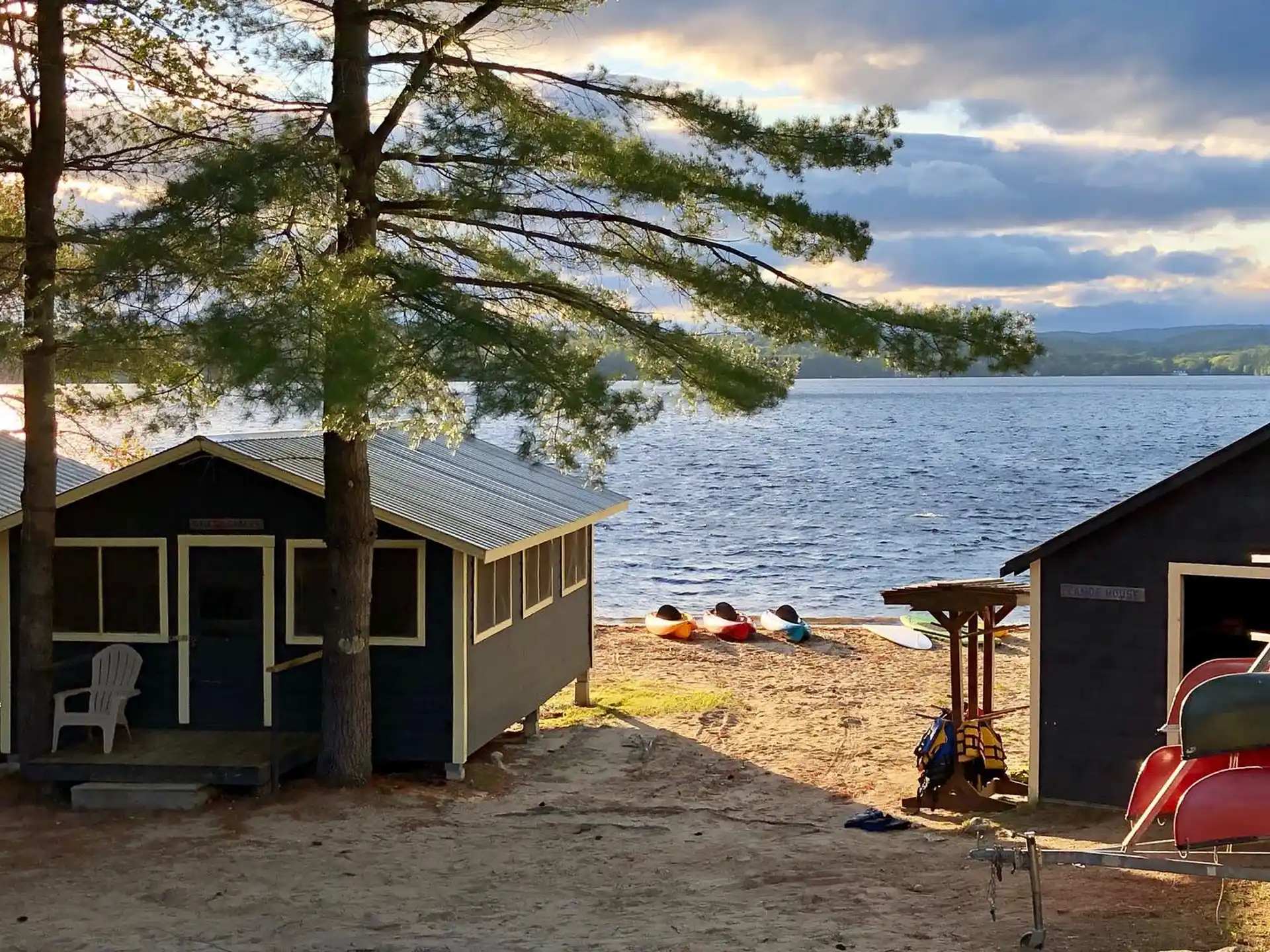 a small house next to a body of water