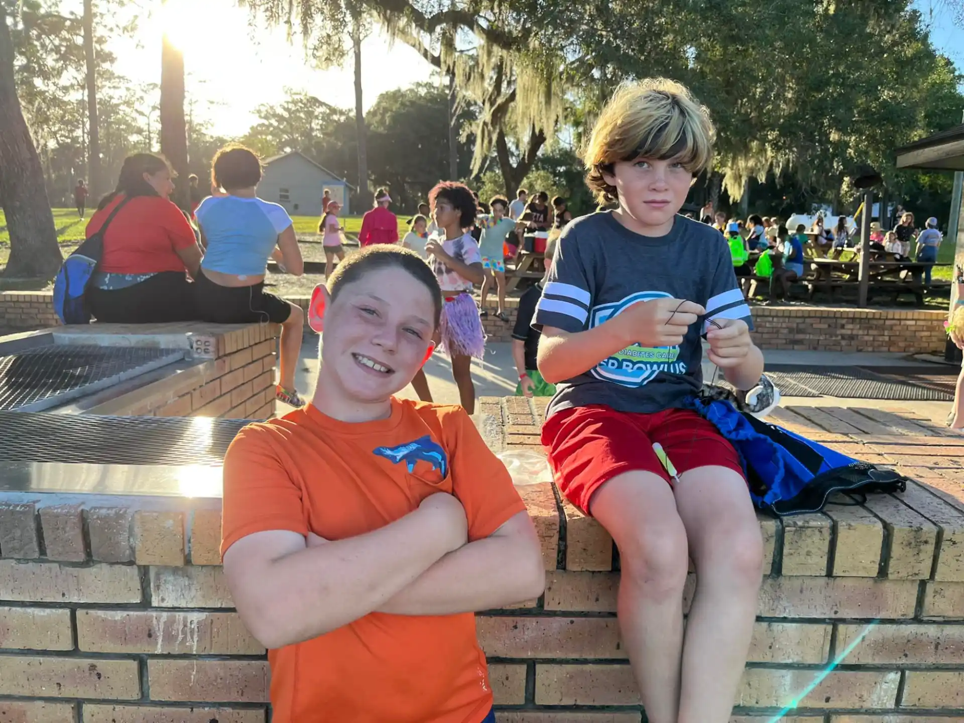 two boys sitting on a bench