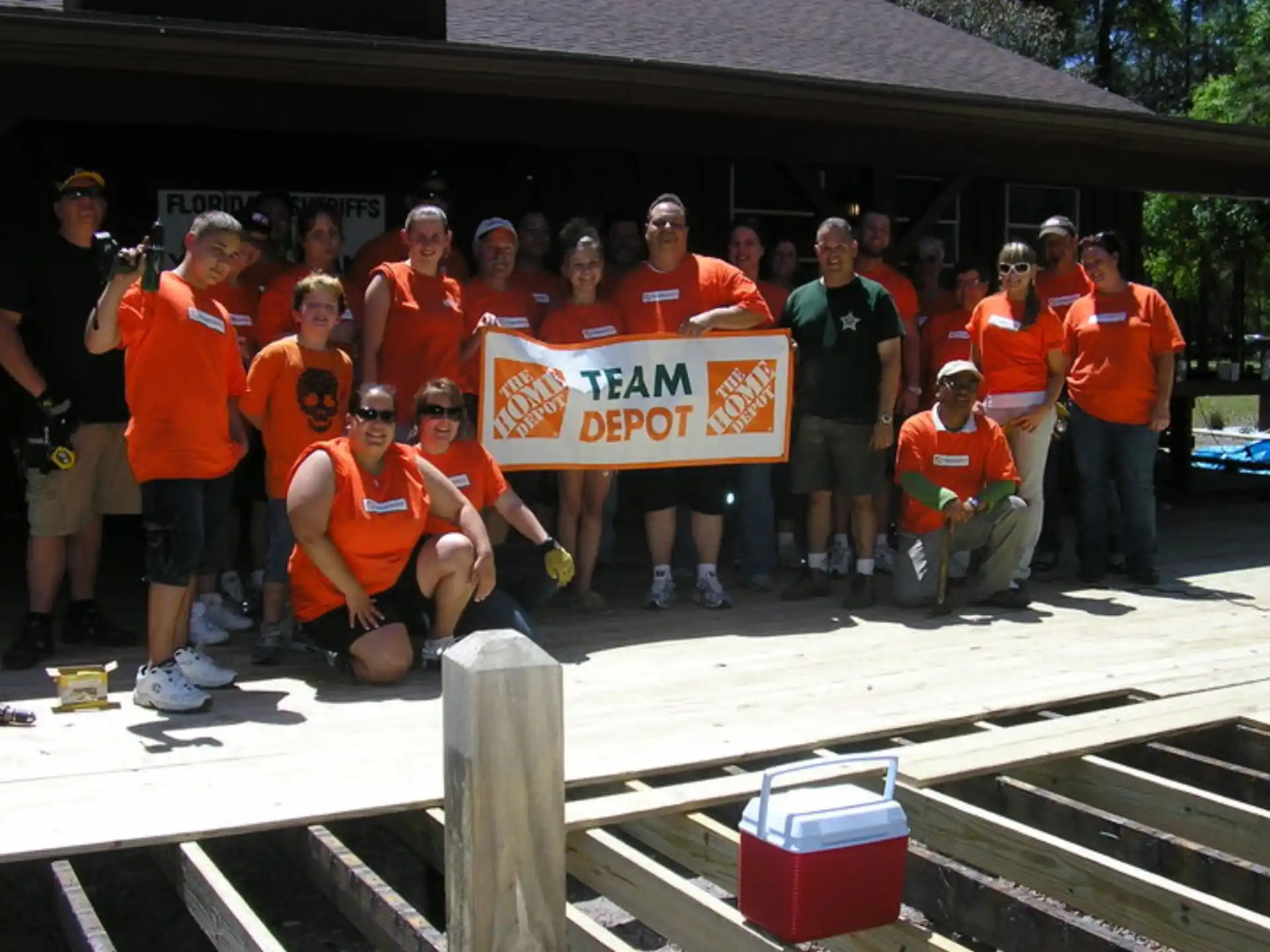 a group of people holding a sign