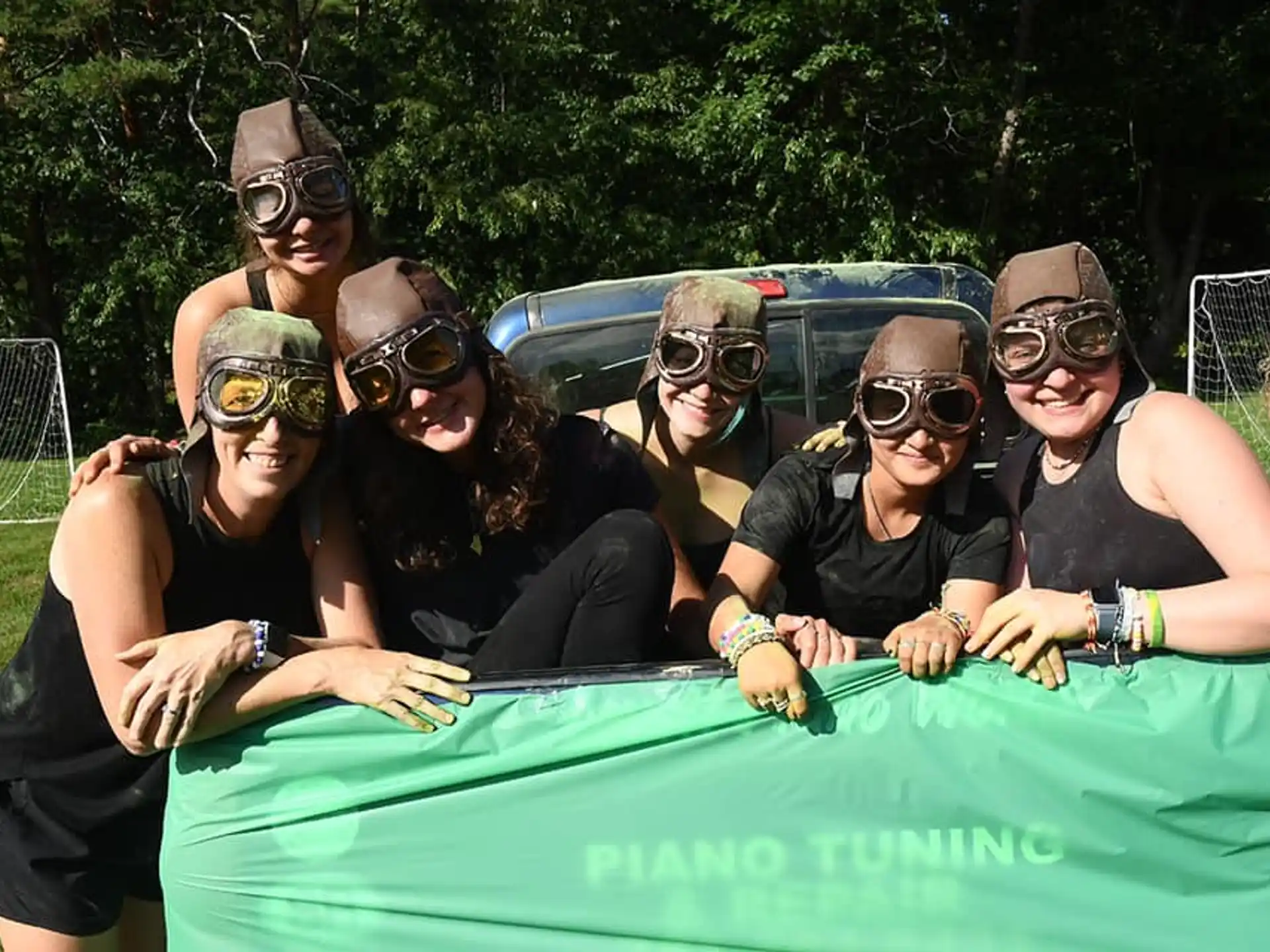 a group of people wearing masks and posing for the camera