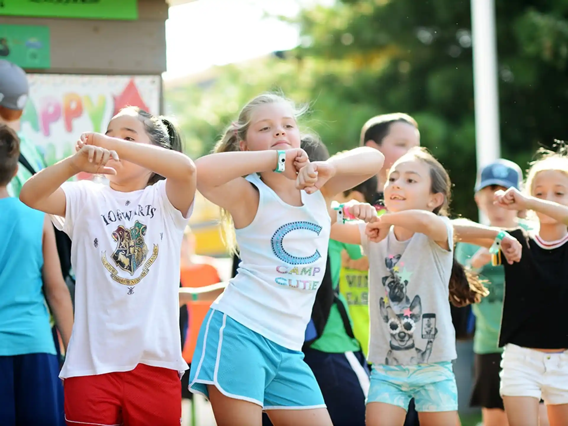 a group of girls in matching t-shirts