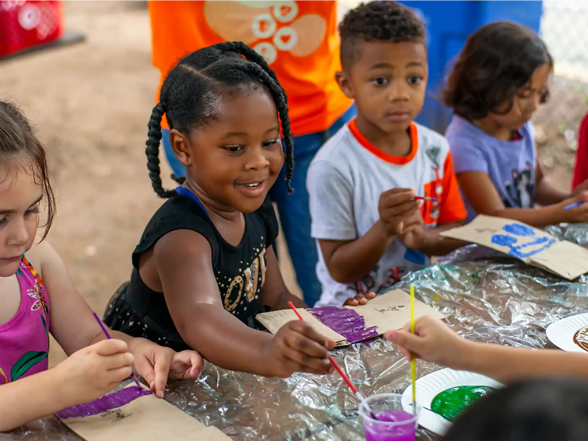 a group of children painting