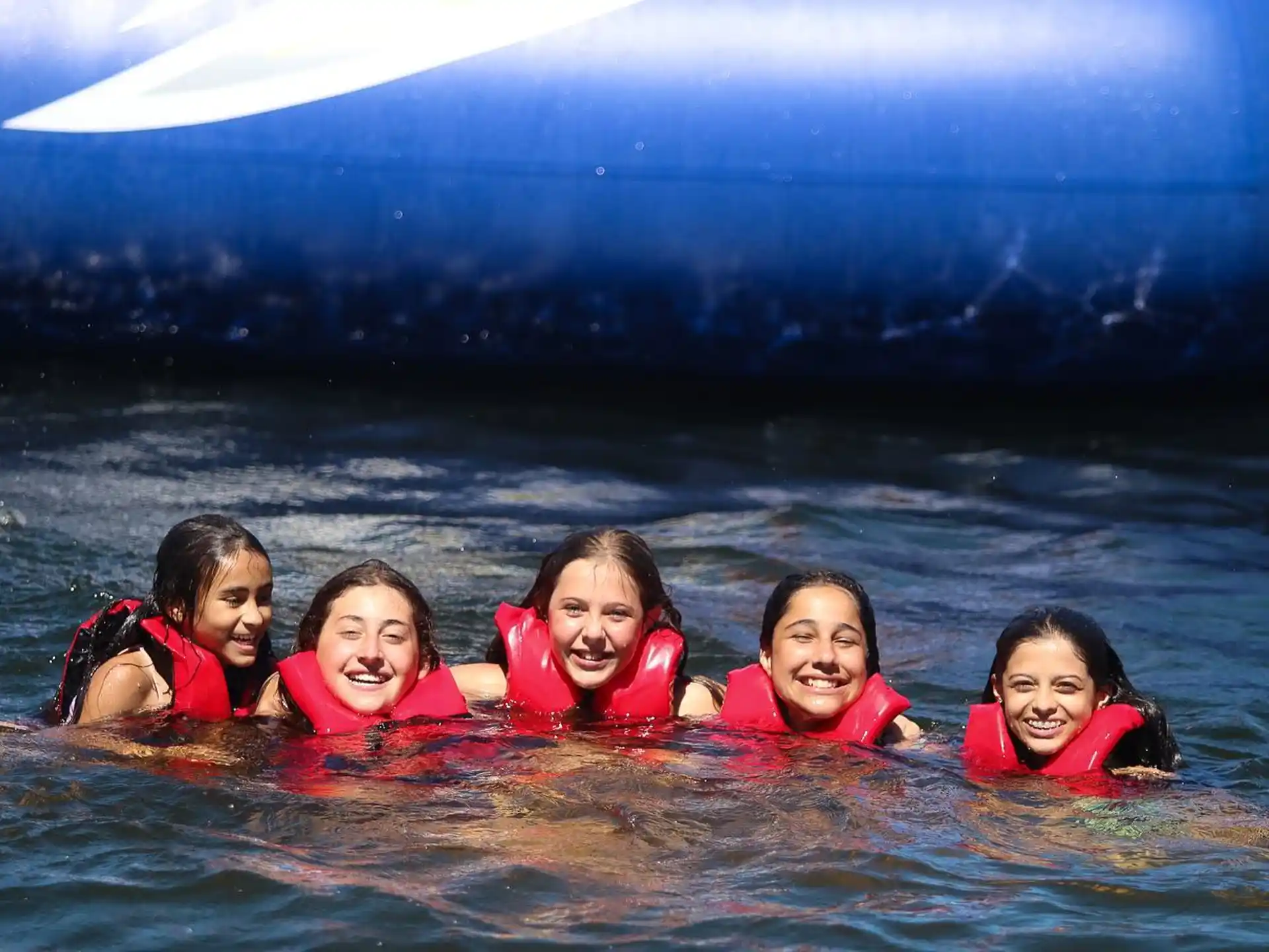 a group of girls in the water
