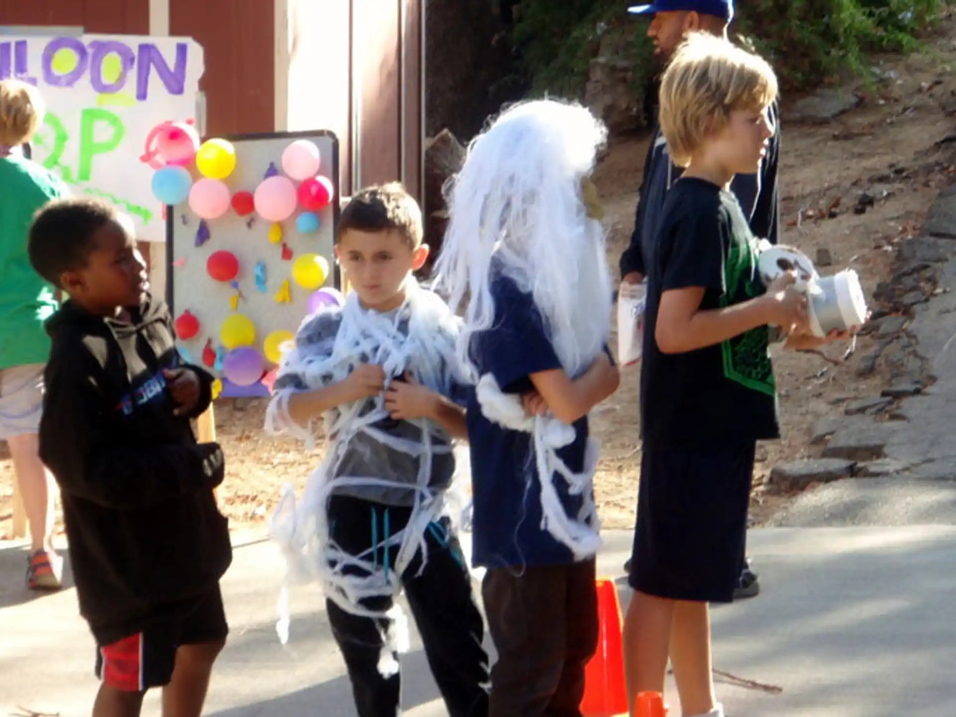 a group of children holding bottles