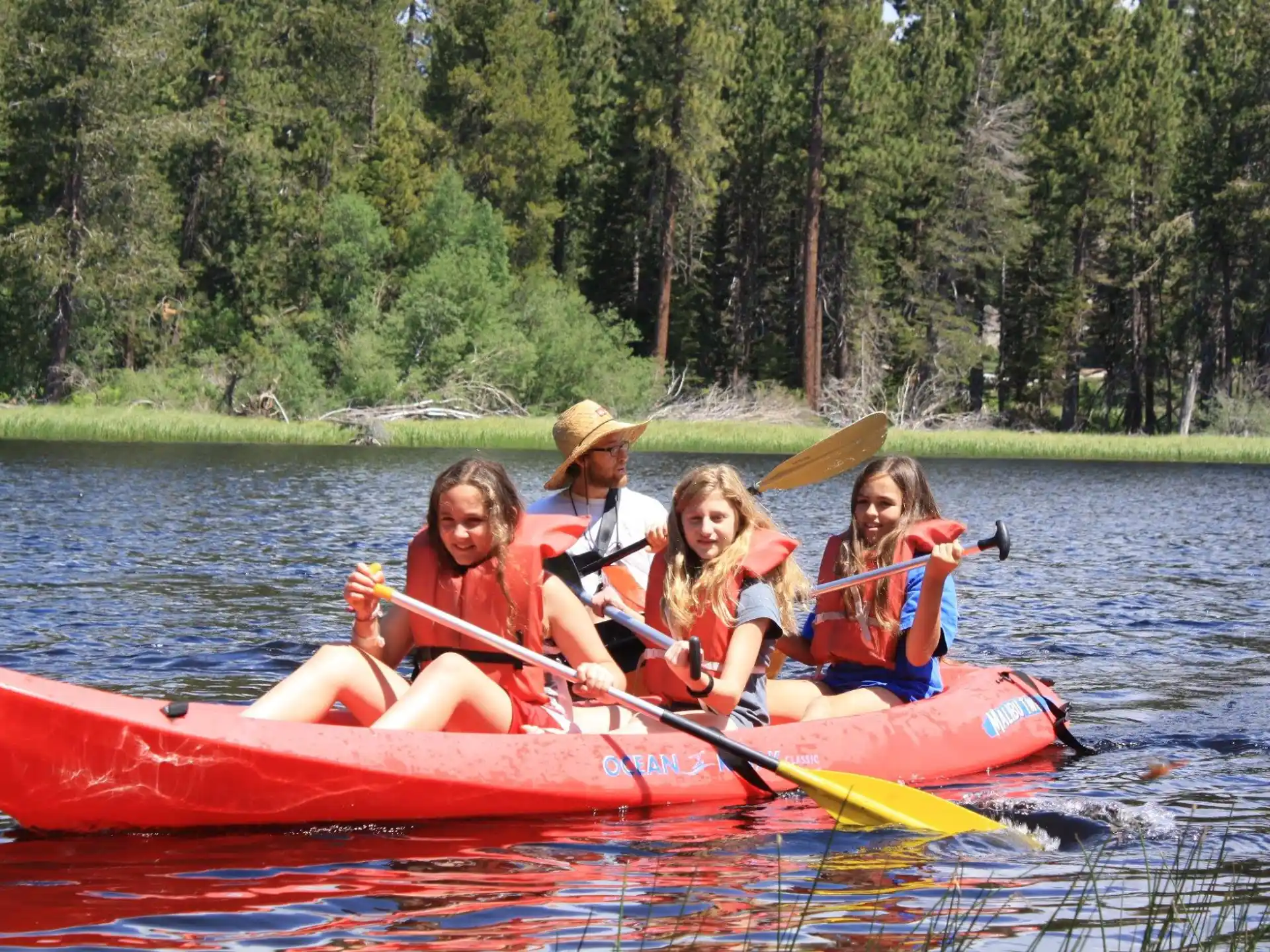 a group of people in a canoe