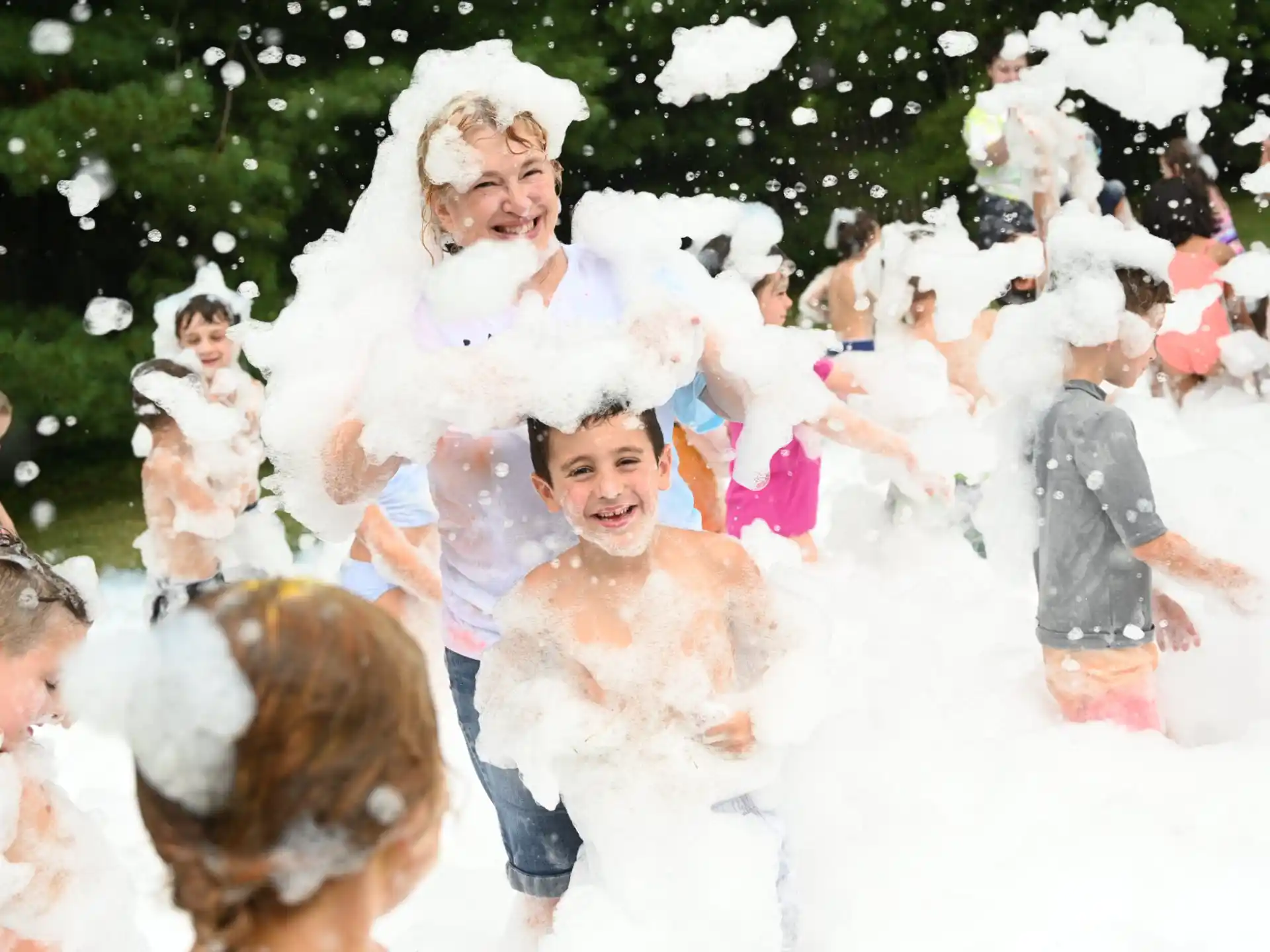 a group of children playing in the snow