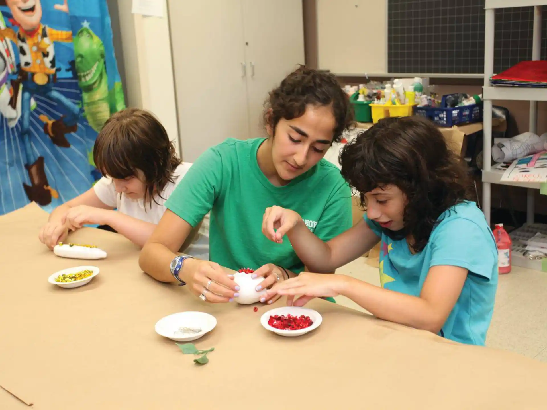 a man and a woman playing with toys on a table