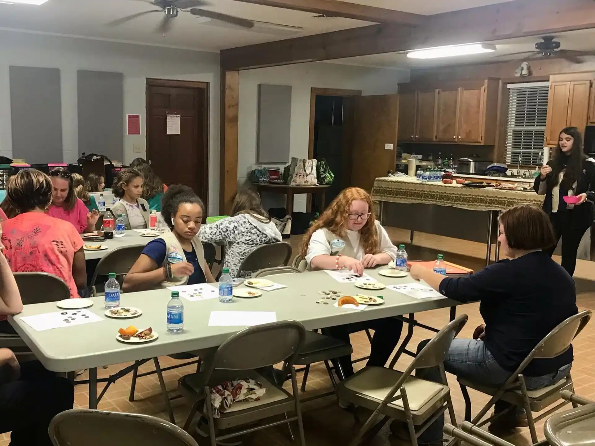 a group of people sitting around a table