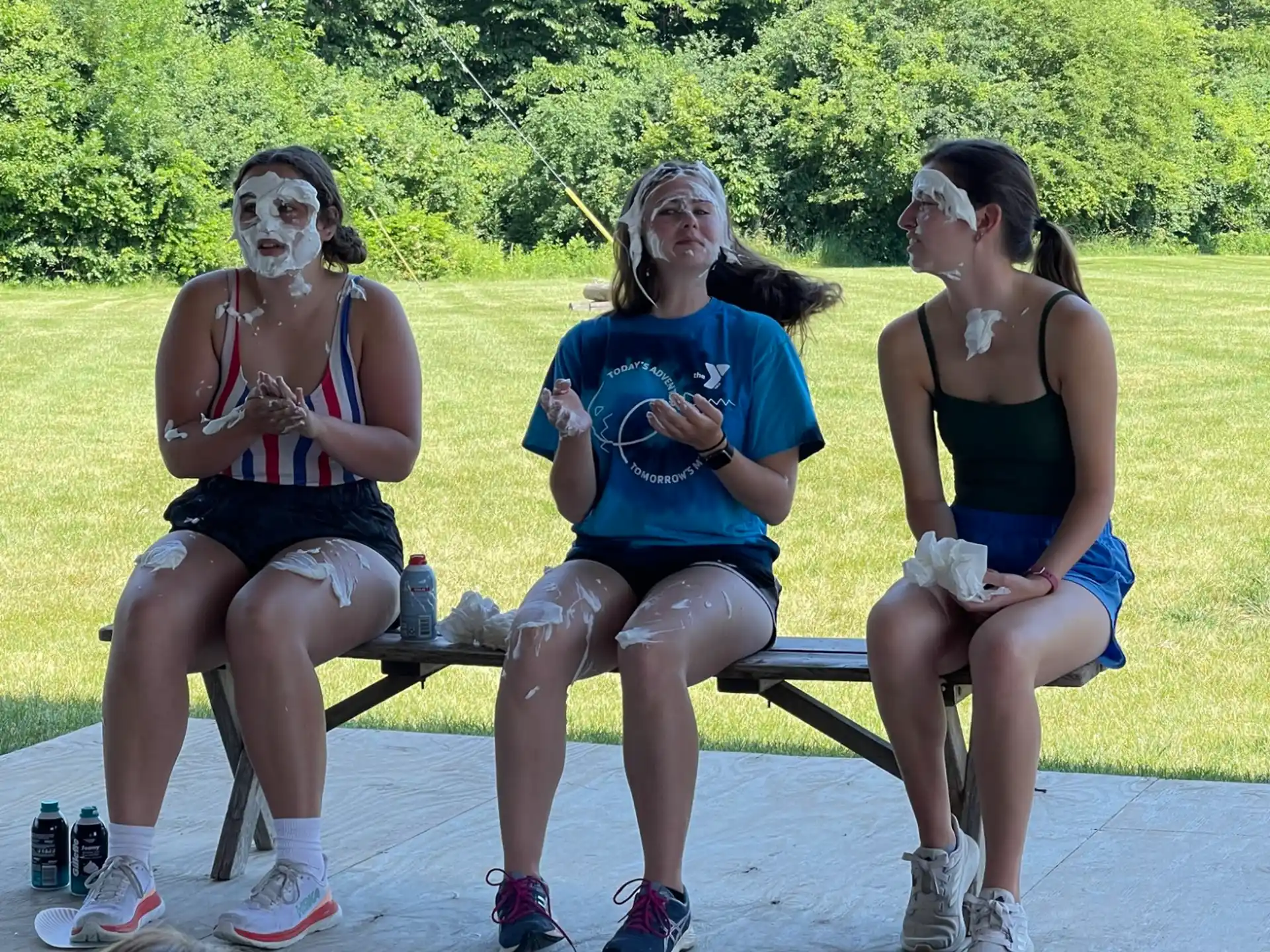 a group of women sitting on a bench