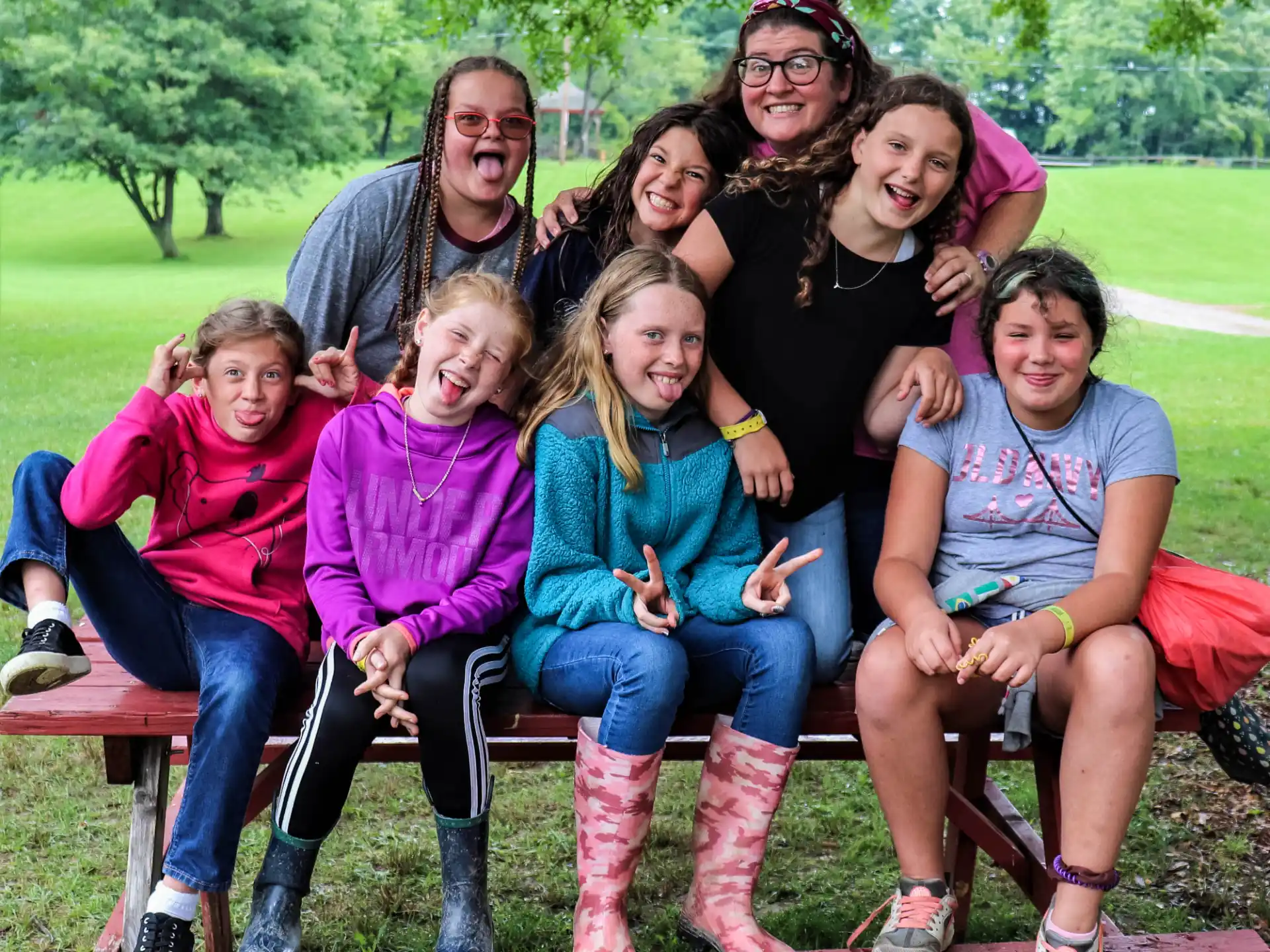 a group of people sitting on a bench
