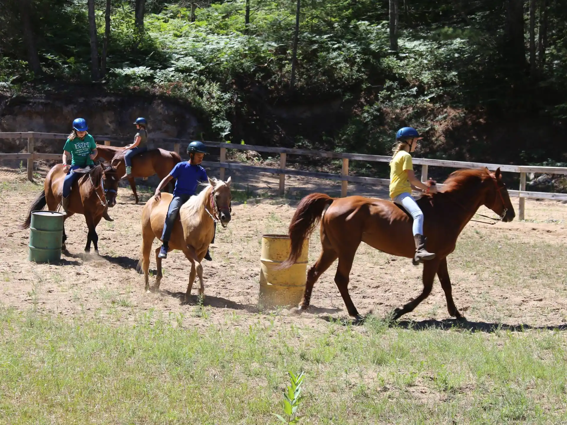 a group of people riding horses