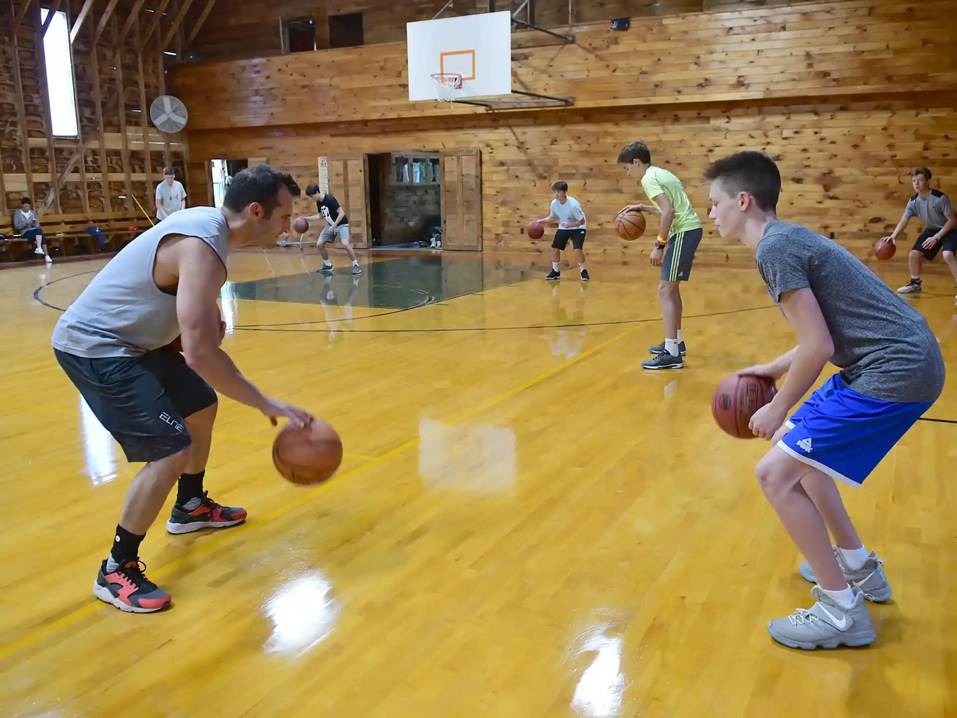 a group of people playing basketball