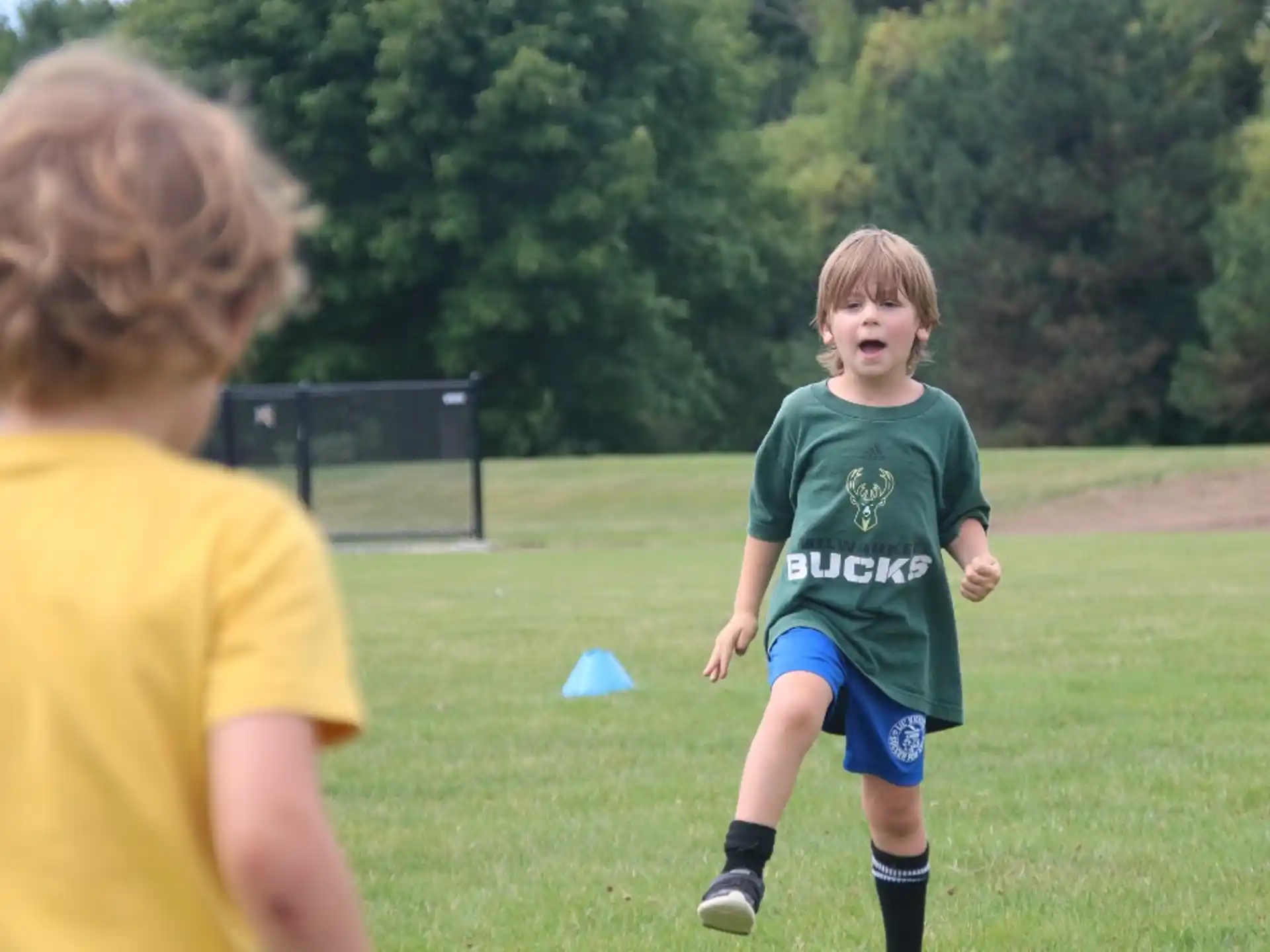 a boy running in a field
