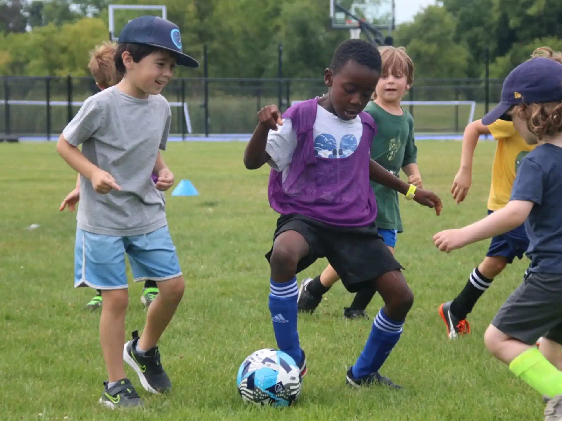 a group of kids playing football