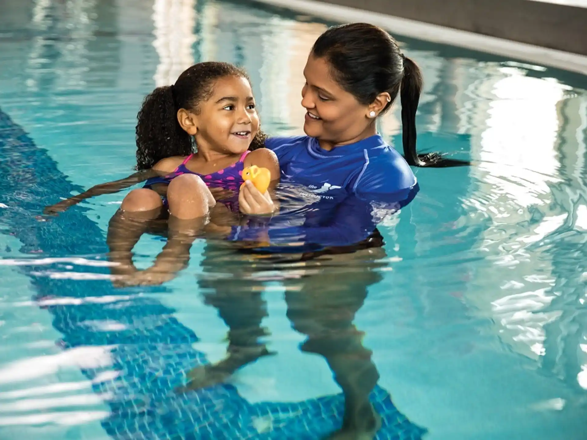 a couple of girls in a pool