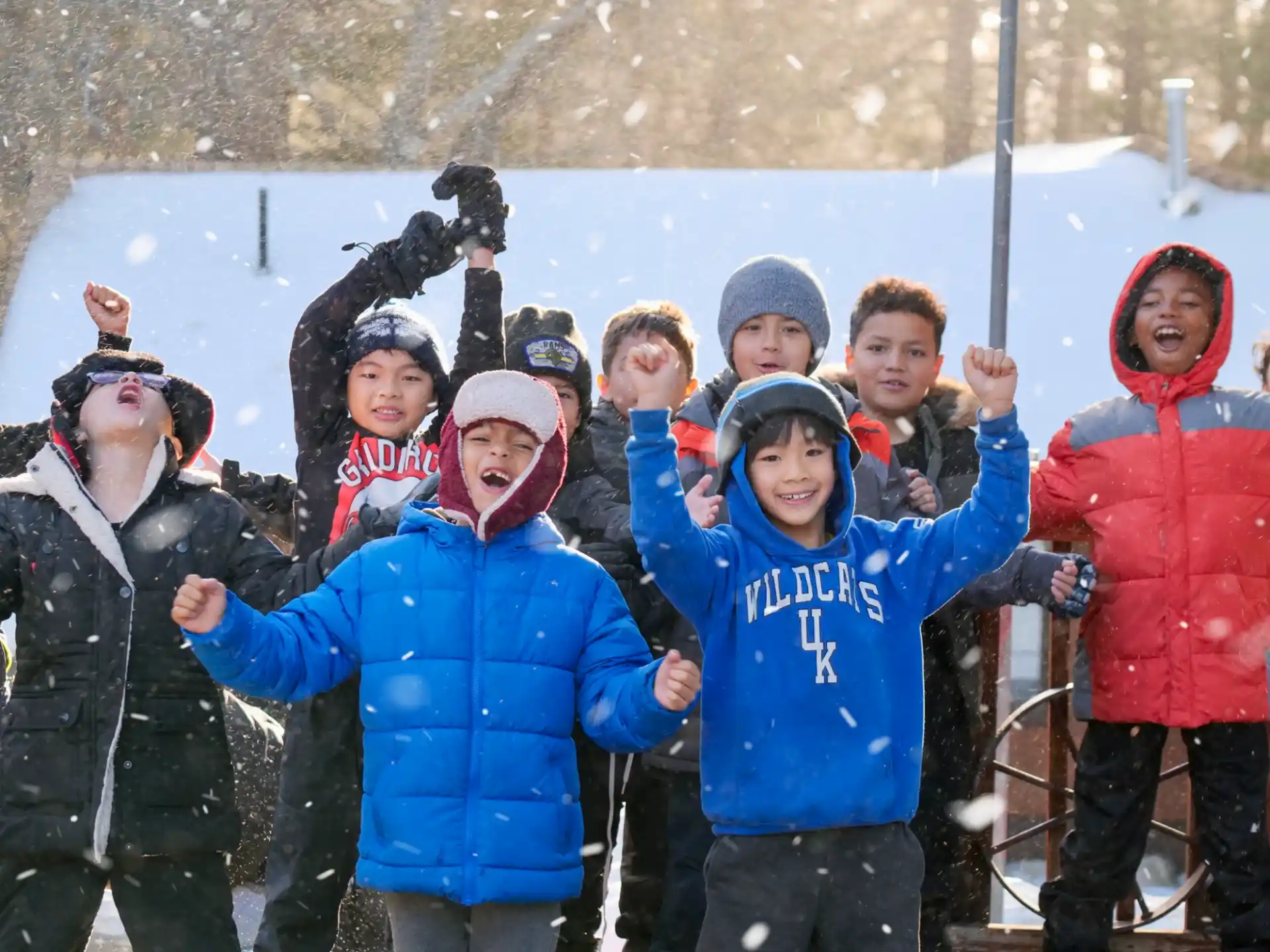 a group of people posing for a photo in the snow