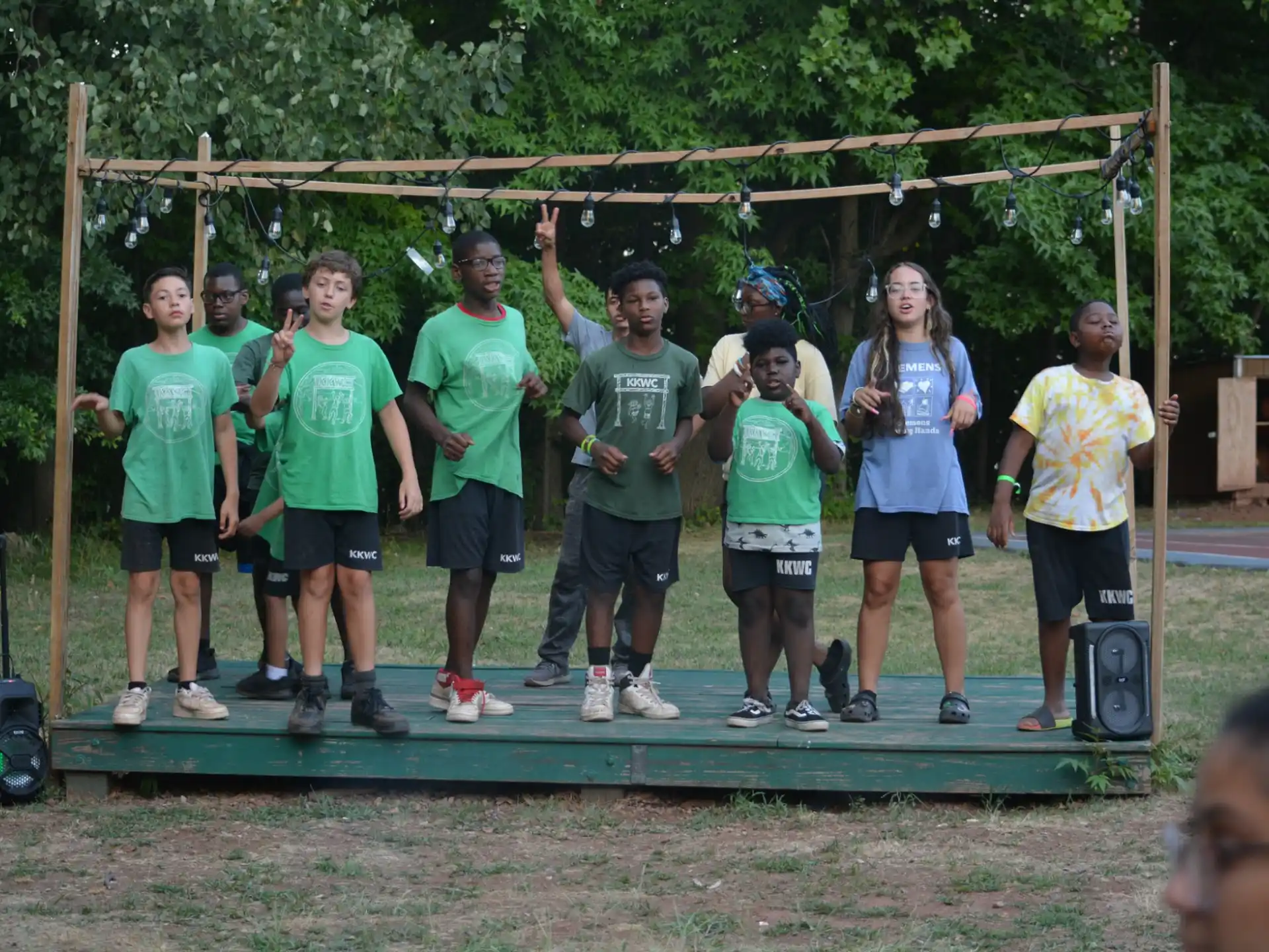 a group of people standing on a trampoline