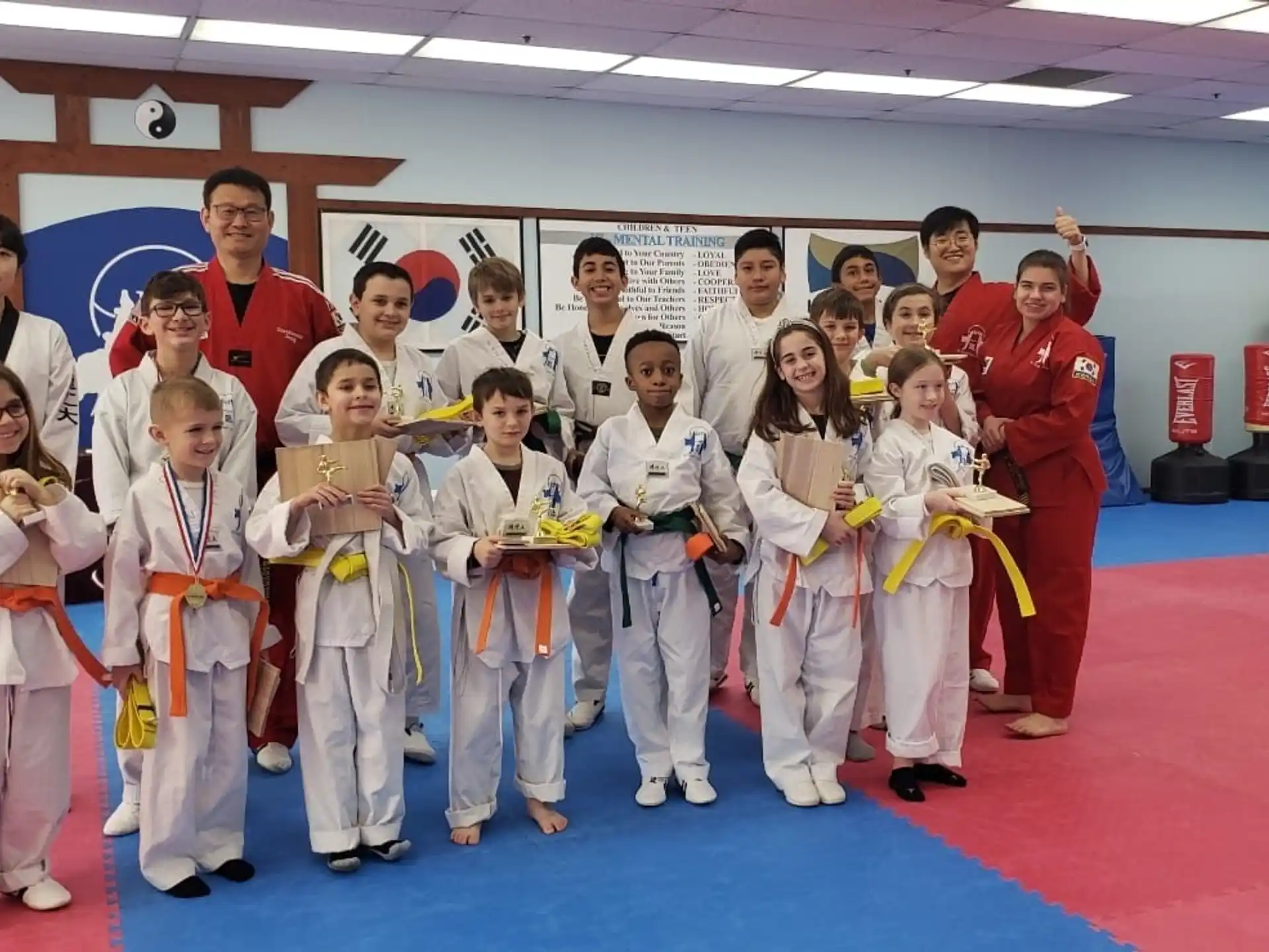 a group of people in karate uniforms
