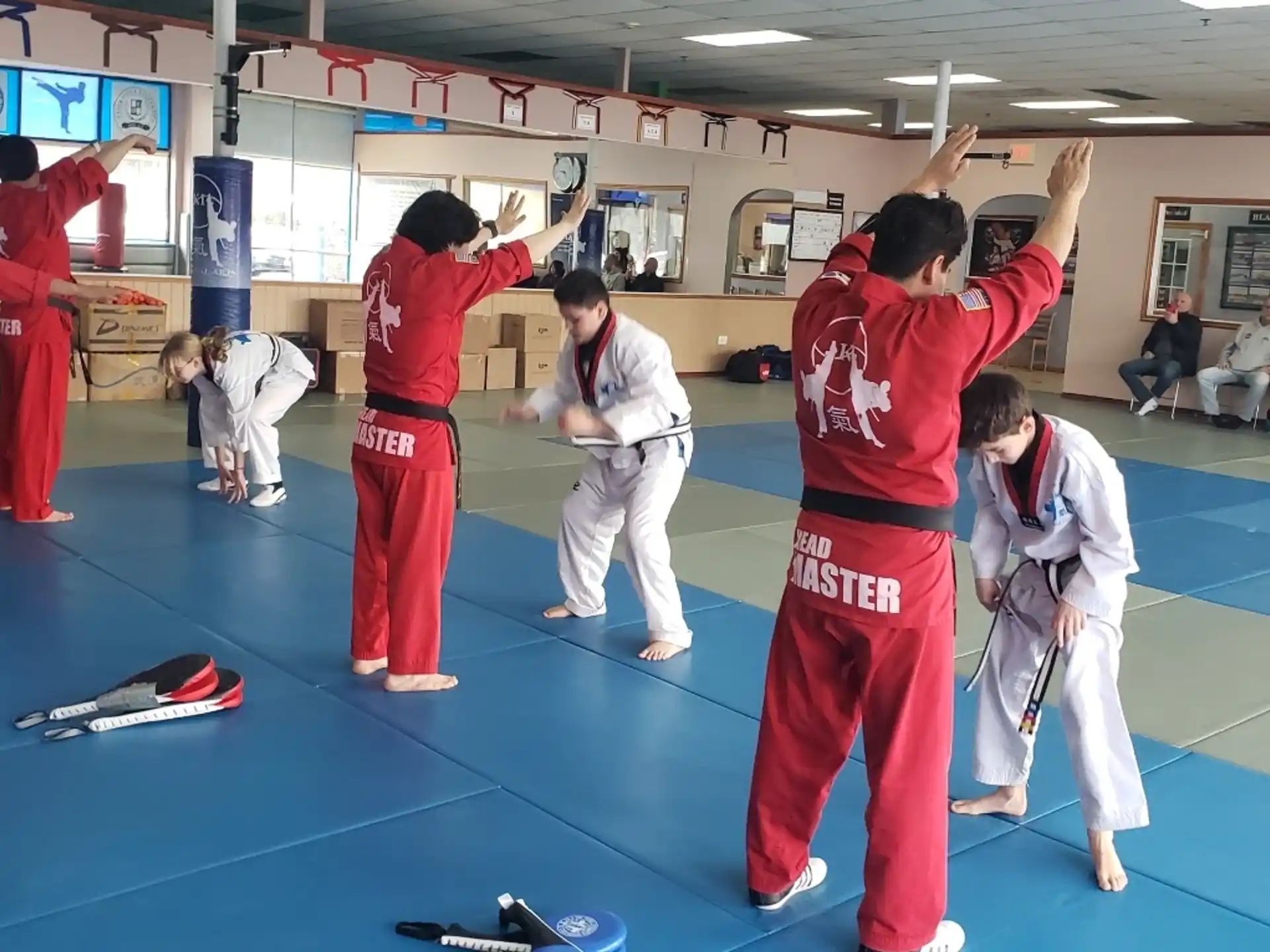 a group of people in karate uniforms