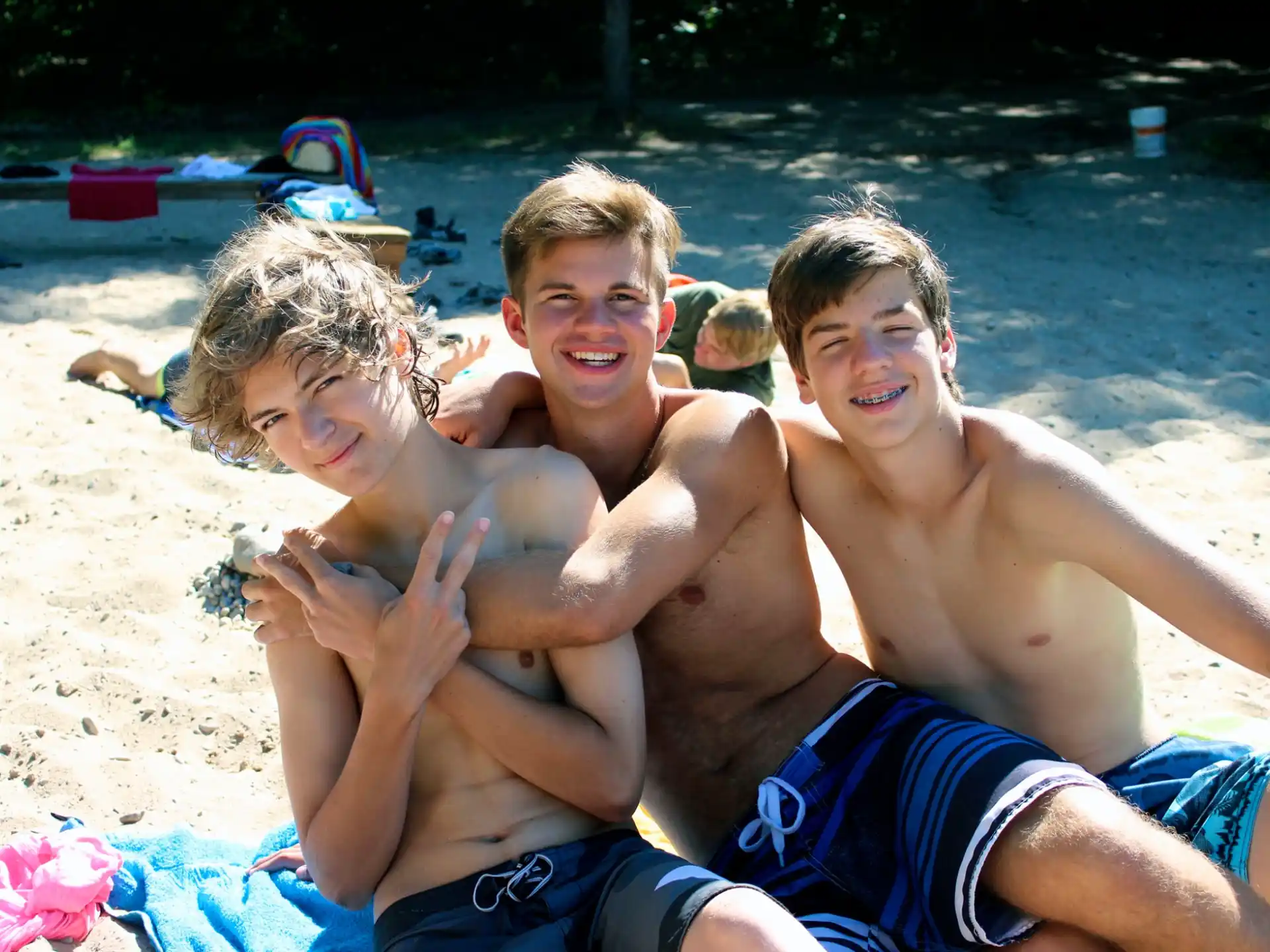 a group of boys on a beach